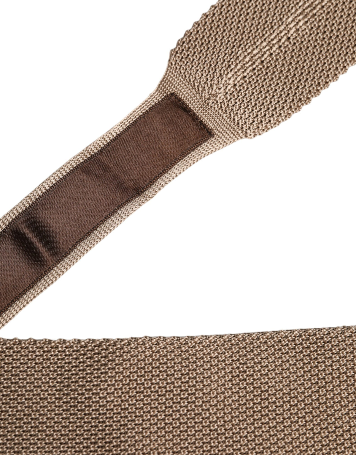 Discover the Dolce & Gabbana Brown Silk Adjustable Necktie, a masterpiece of Italian craftsmanship that elevates your style with timeless elegance and luxurious allure.