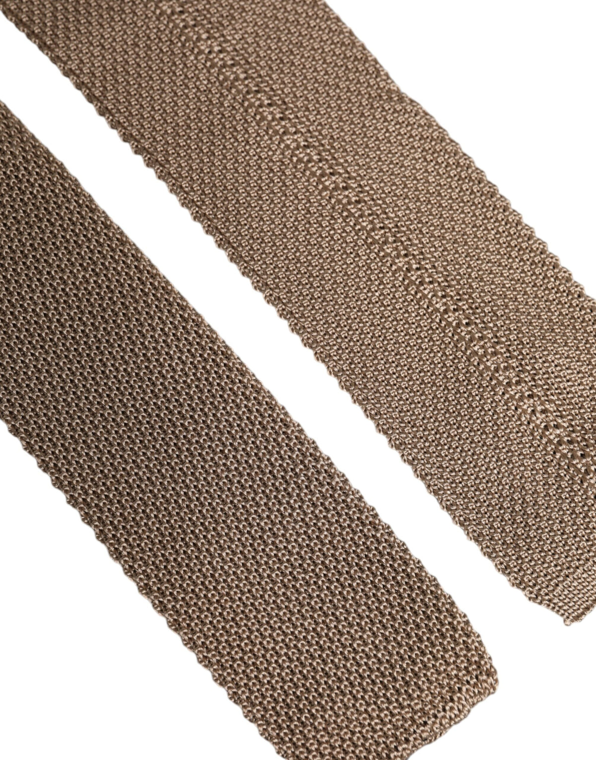Indulge in the exquisite Dolce & Gabbana Brown Silk Adjustable Necktie, a timeless accessory crafted from luxurious silk, embodying sophistication and elegance for the discerning individual.