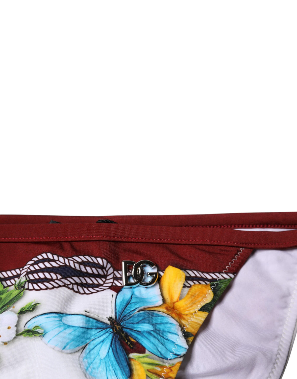 Indulge in the exquisite allure of Dolce & Gabbana's White Floral Print Bikini Bottom, crafted from premium materials for a sophisticated fit that embodies timeless elegance.