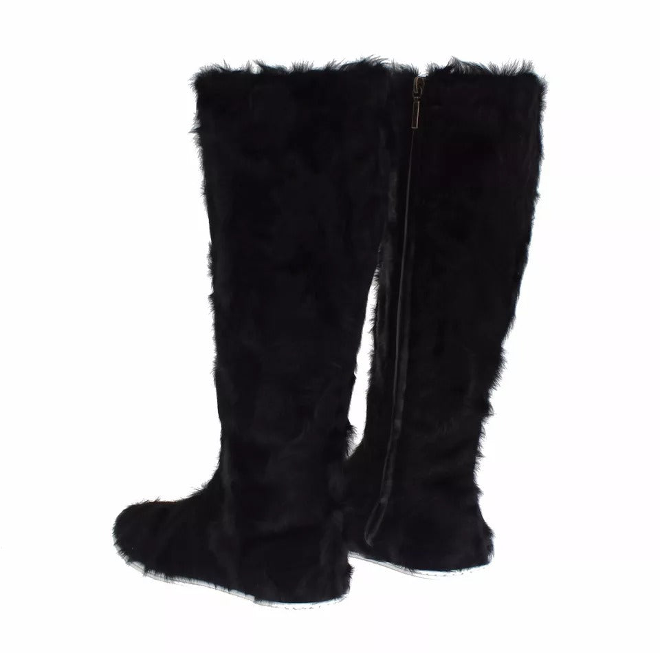 Step into luxury with Dolce & Gabbana's Black Xiangao Lamb Fur Leather Boots, crafted from exquisite materials for timeless elegance and effortless sophistication.