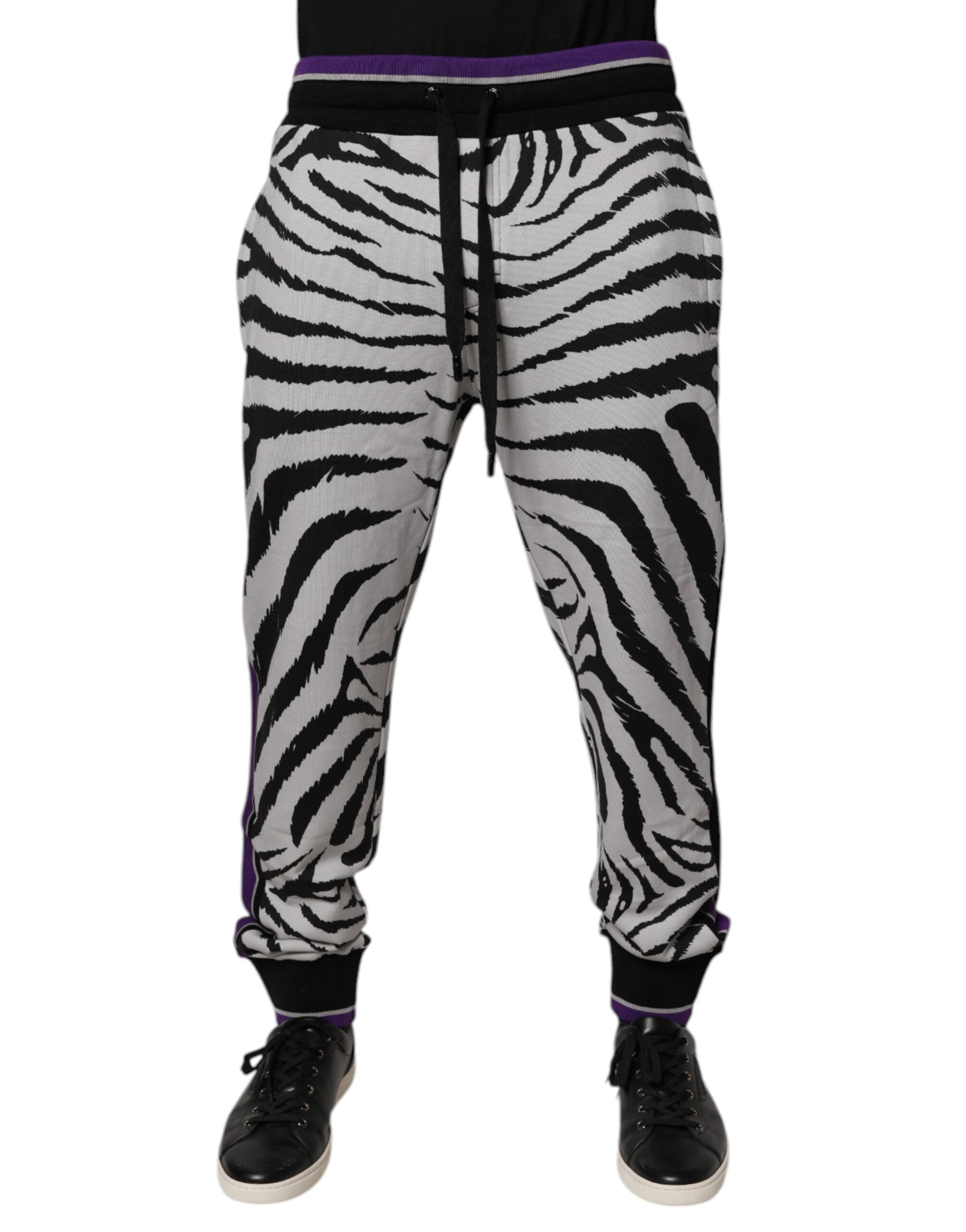 Indulge in the exquisite craftsmanship of Dolce & Gabbana's Black White Zebra Jogger Sweatpants, where luxurious cotton meets bold design for unparalleled style and comfort.