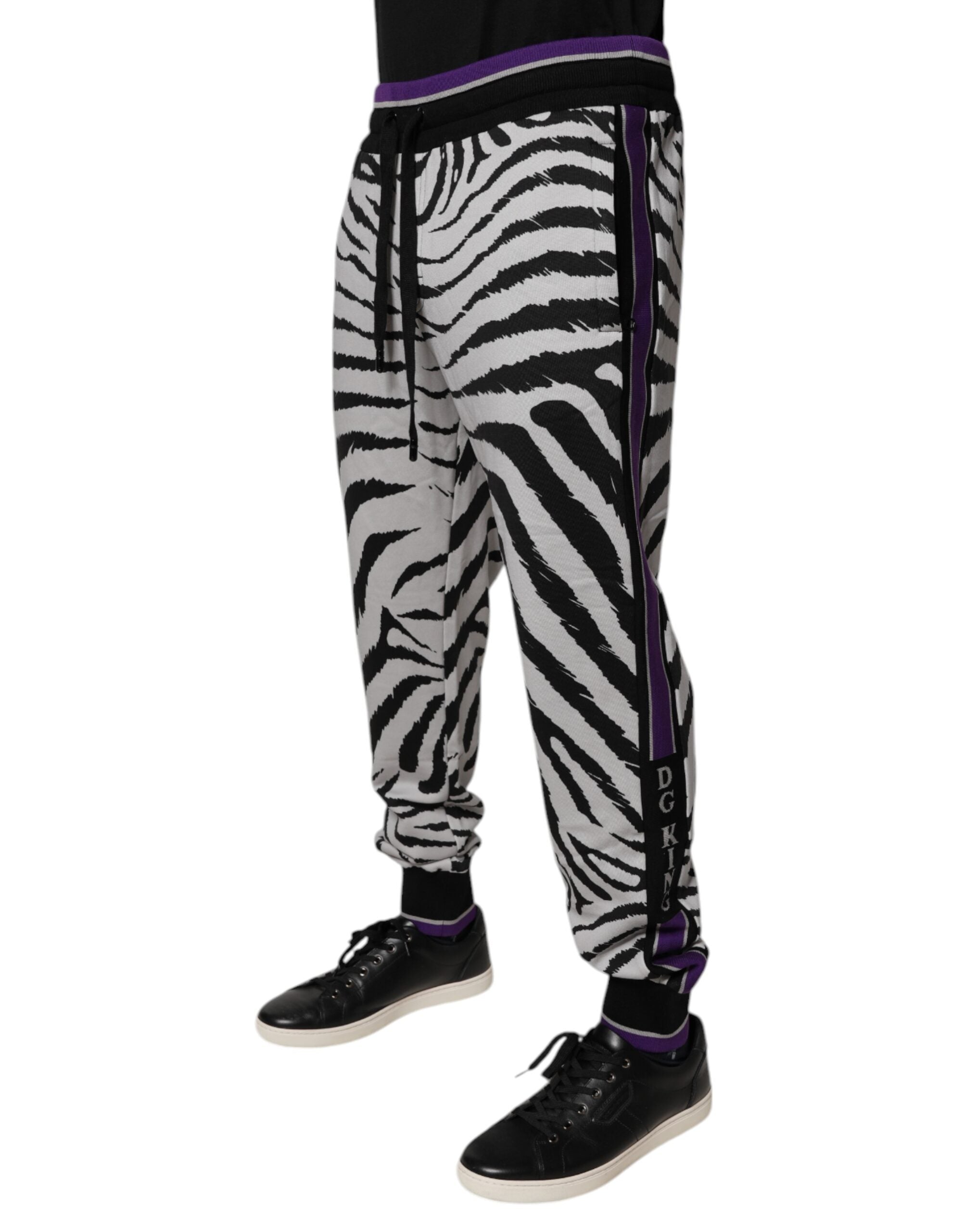 Indulge in the exquisite craftsmanship of Dolce & Gabbana's Black White Zebra Jogger Sweatpants, where luxurious cotton meets bold design for a statement of refined elegance.