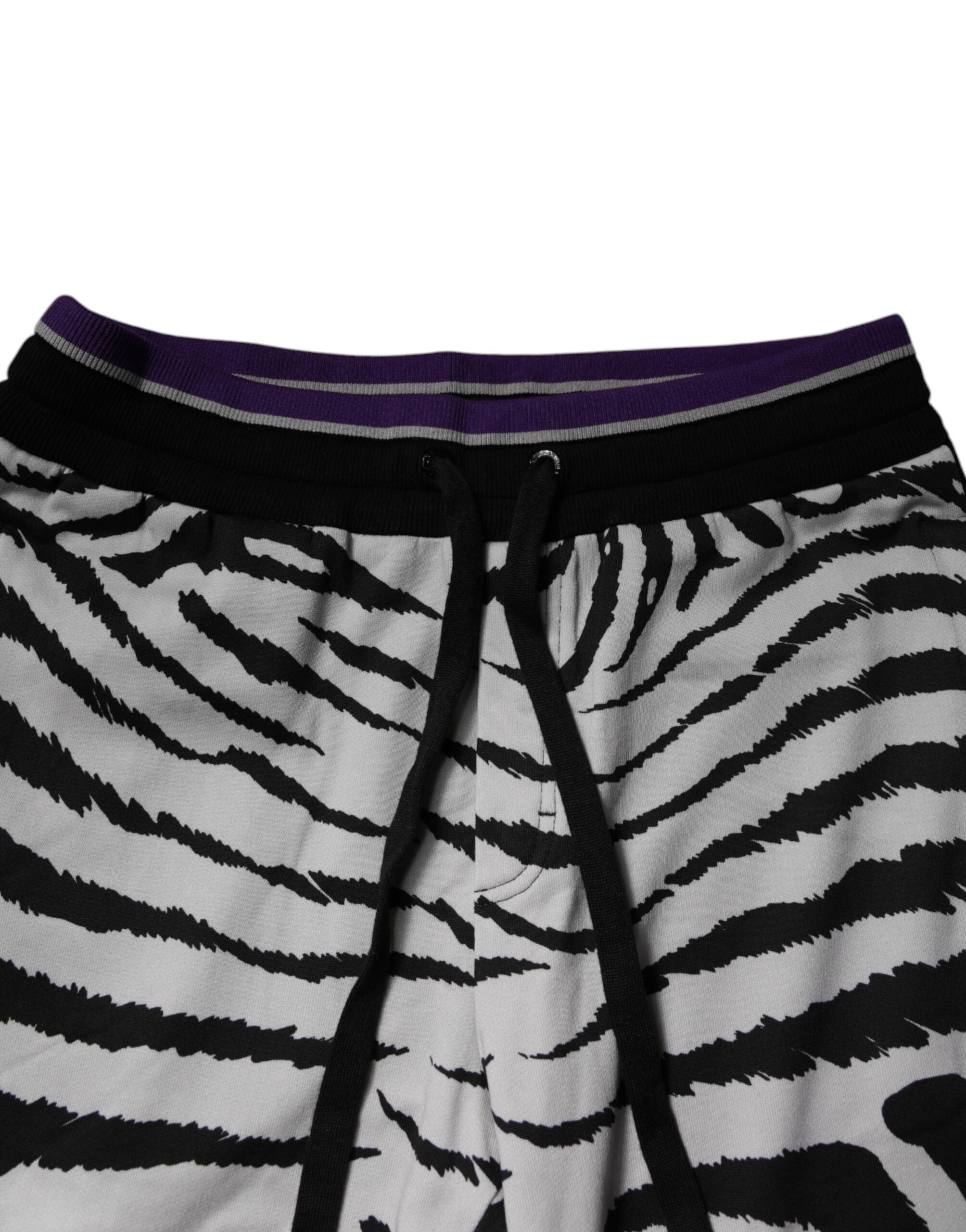 Indulge in the exquisite craftsmanship of Dolce & Gabbana's Black White Zebra Jogger Sweatpants, where luxurious cotton meets bold design for a sophisticated statement.
