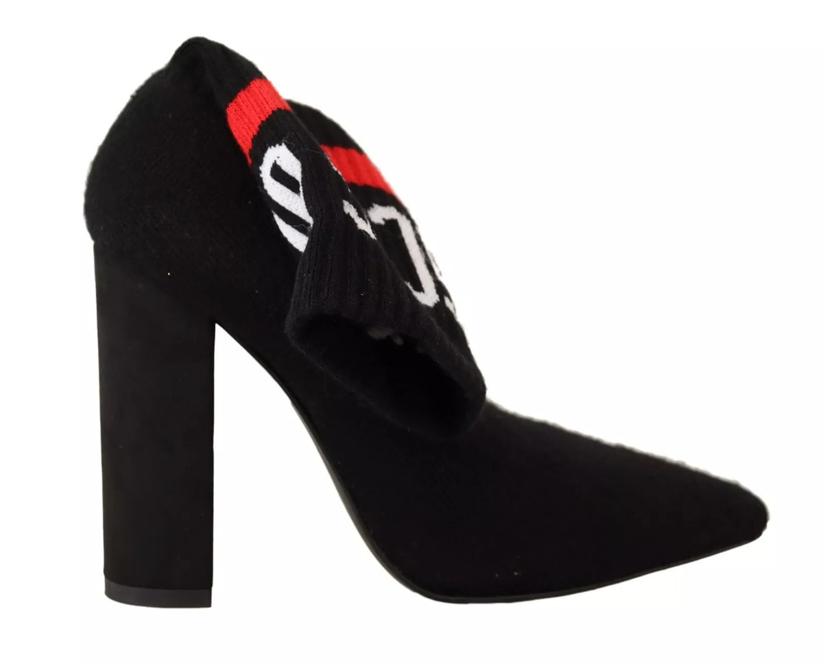 Elevate your style with GCDS Black Suede Logo Socks Block Heel Ankle Boots, where exquisite craftsmanship meets luxurious materials for an unforgettable statement.
