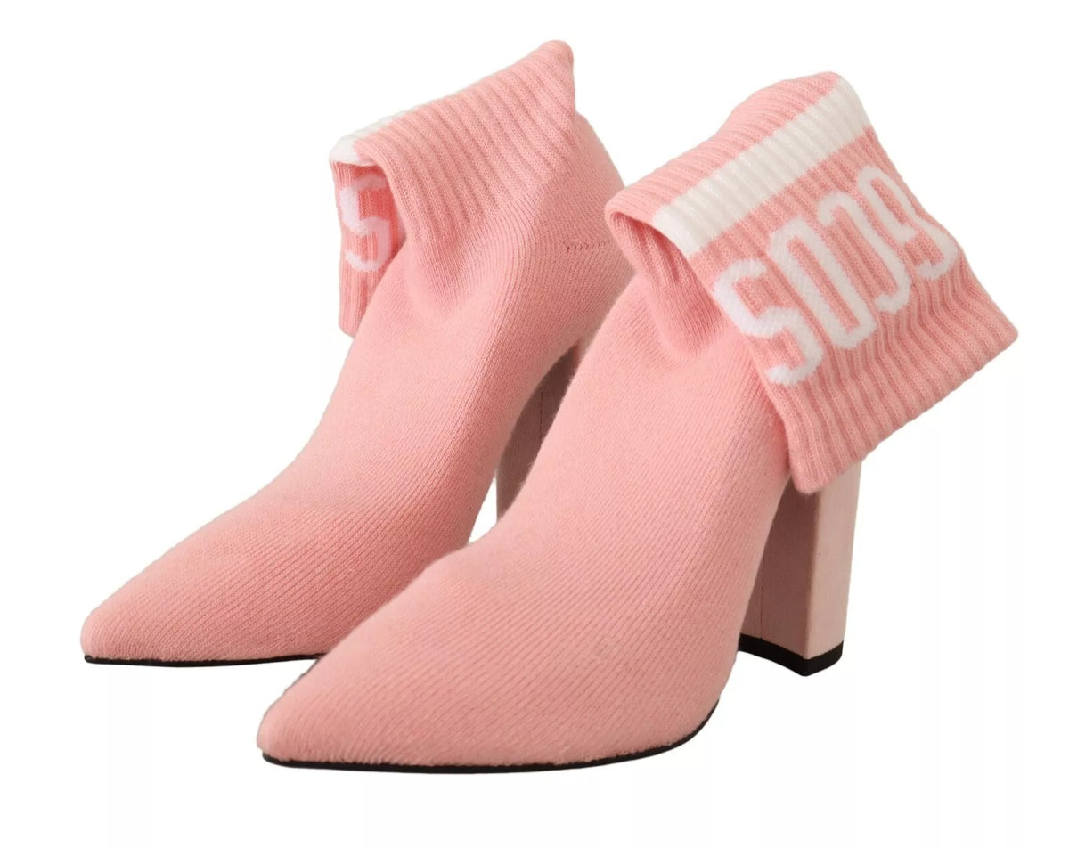 Elevate your style with GCDS Pink Suede Logo Socks Block Heel Ankle Boots, where exquisite craftsmanship meets avant-garde design for the discerning individual.