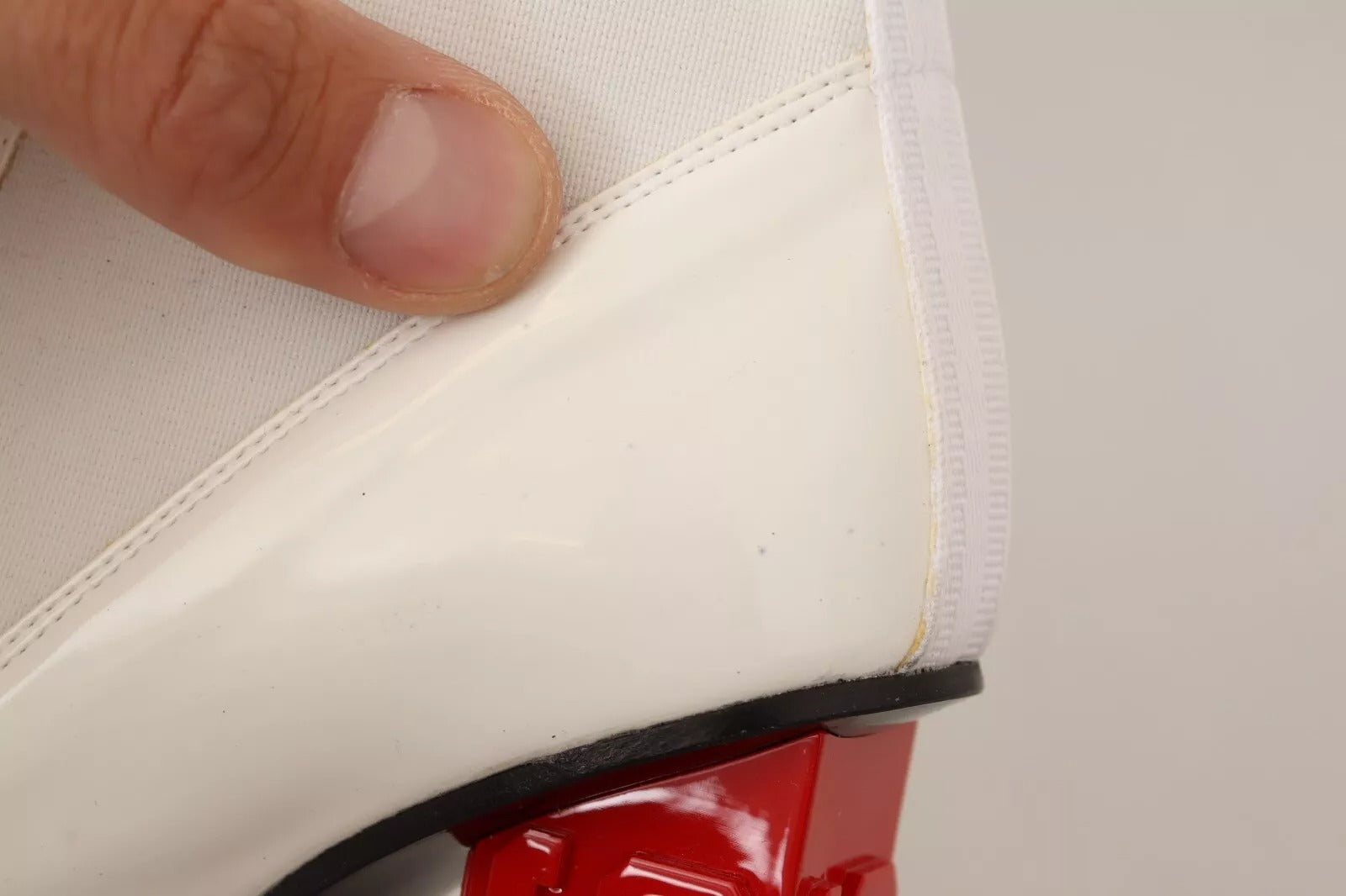 Elevate your style with GCDS White Leather Fabric Red Logo Heel Ankle Boots, where exquisite craftsmanship meets bold design for the discerning individual.