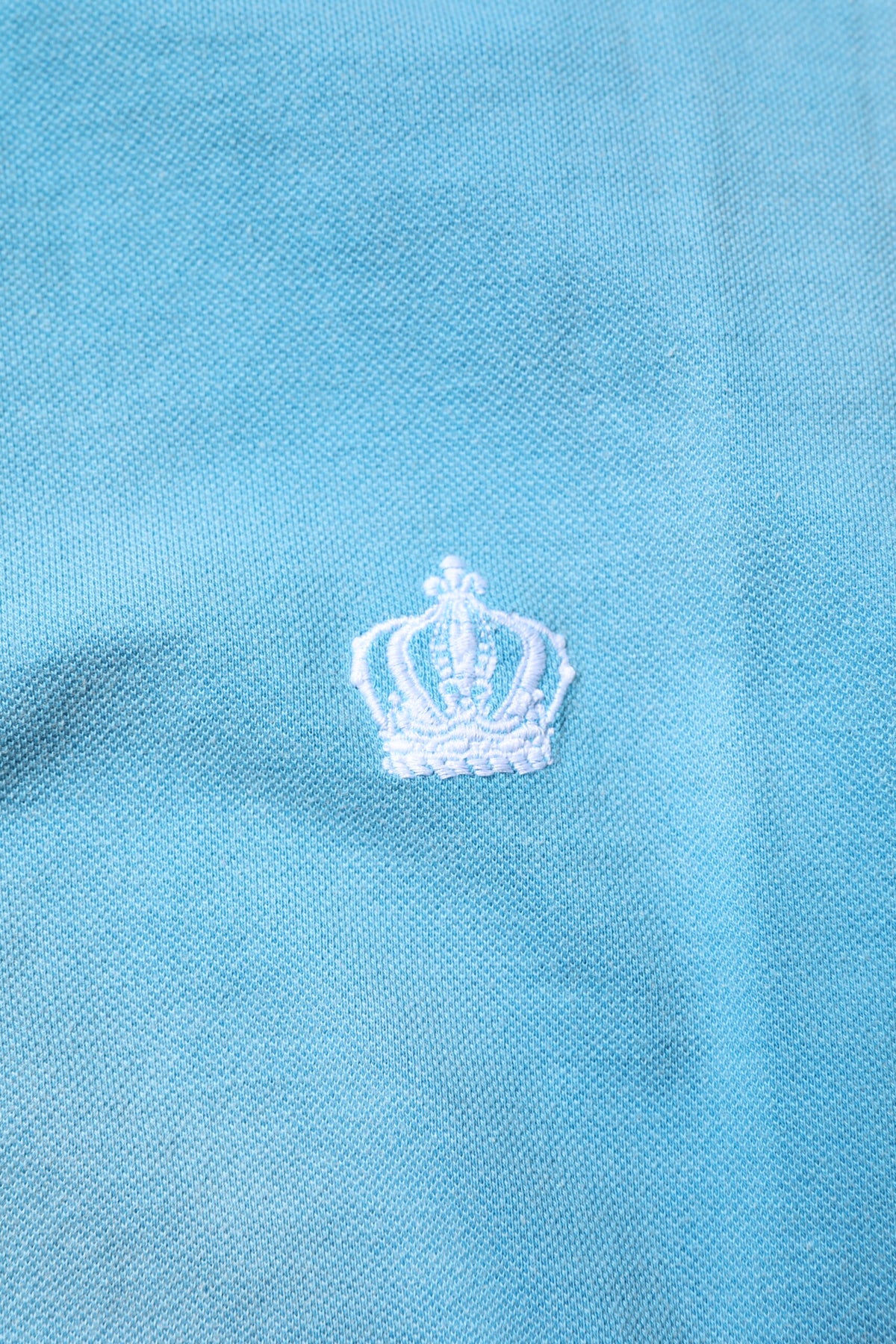 Indulge in the exquisite Dolce & Gabbana Blue Cotton Crown Collared Polo T-shirt, a testament to Italian craftsmanship that elevates your wardrobe with luxurious elegance.