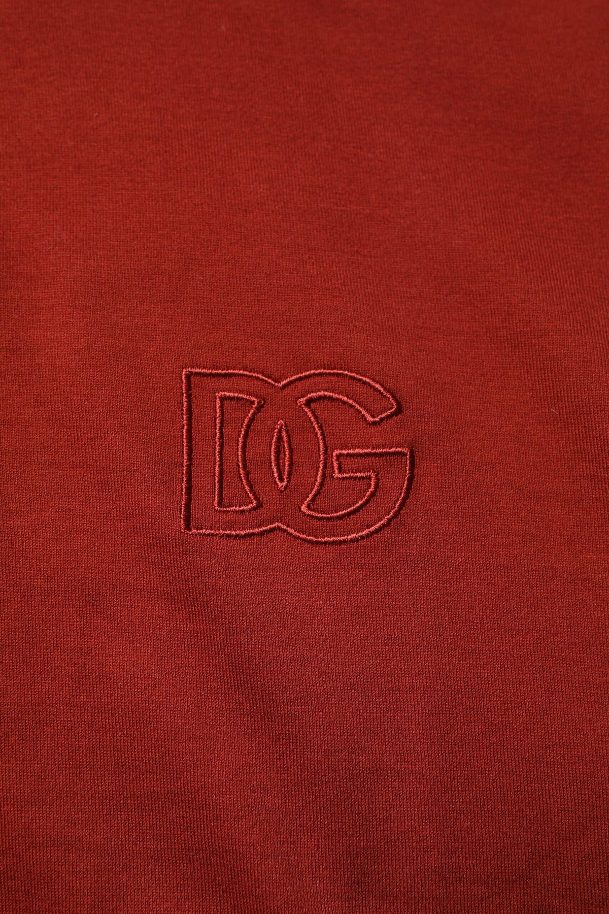 Experience the allure of Dolce & Gabbana's Red Cotton DG Logo Collared Polo T-shirt, a masterpiece of Italian craftsmanship that redefines luxury and sophistication.
