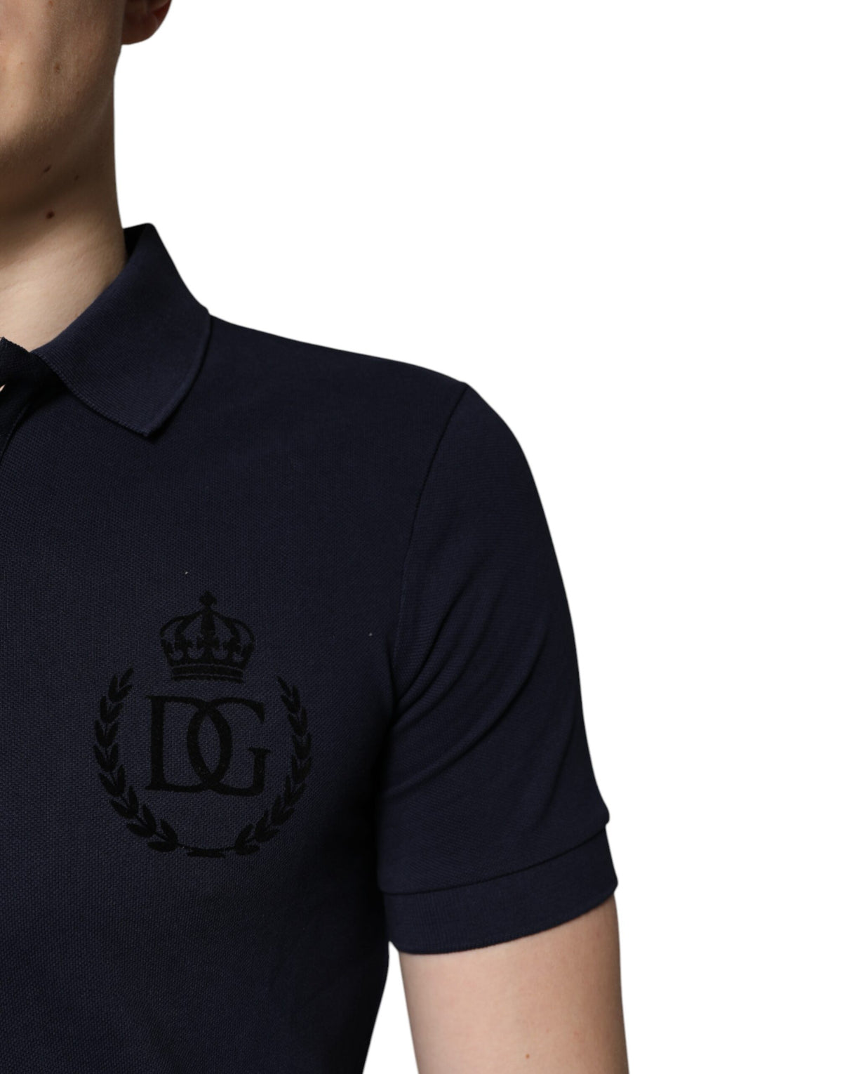 Elevate your wardrobe with the Dolce & Gabbana Dark Blue Cotton Crown Collared Polo T-shirt, a timeless piece crafted from luxurious cotton, embodying sophistication and effortless elegance.