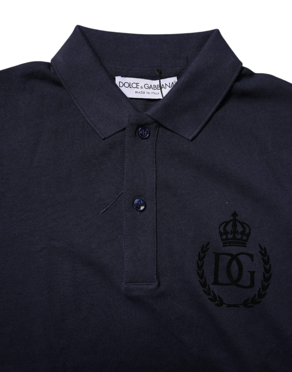 Elevate your style with the Dolce & Gabbana Dark Blue Cotton Crown Collared Polo T-shirt, a masterpiece of Italian craftsmanship that embodies timeless luxury and sophistication.