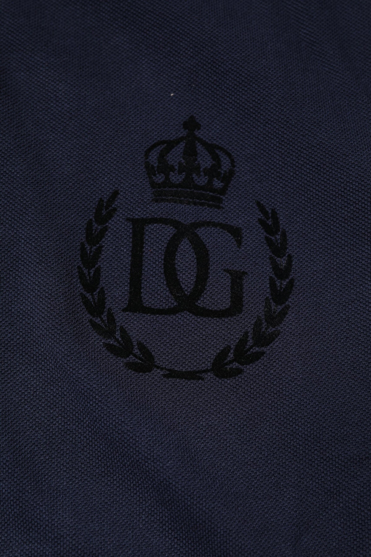 Elevate your wardrobe with the Dolce & Gabbana Dark Blue Cotton Crown Collared Polo T-shirt, a symbol of Italian luxury crafted from 100% cotton for timeless sophistication.