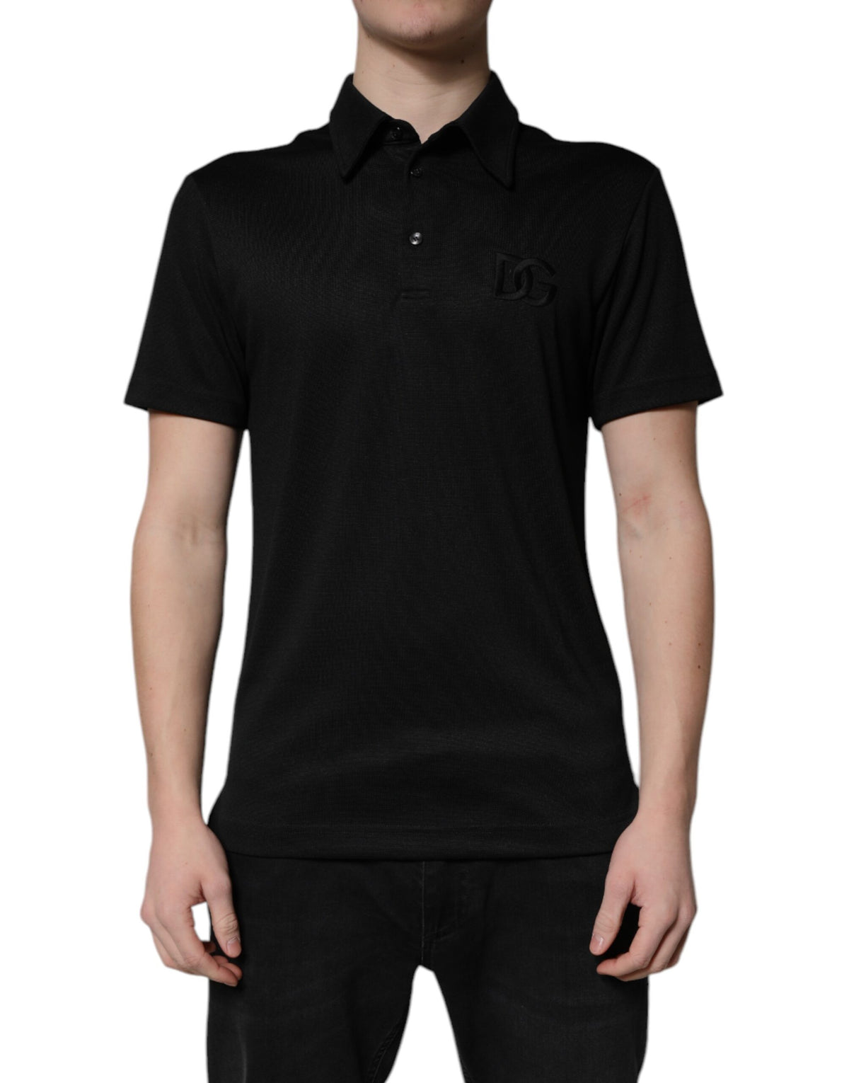 Indulge in the exquisite Dolce & Gabbana Black DG Logo Collared Polo T-shirt, where luxurious materials and timeless design elevate your style to new heights of sophistication.