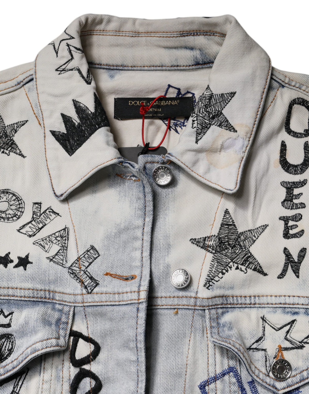 Elevate your wardrobe with the Dolce & Gabbana Light Blue Graffiti Button Down Denim Jacket, a luxurious blend of cotton and elastane, embodying artistry and sophistication for the modern muse.