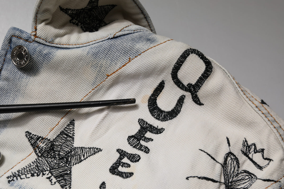 Elevate your wardrobe with the Dolce & Gabbana Light Blue Graffiti Button Down Denim Jacket, a luxurious blend of cotton and elastane, embodying exquisite craftsmanship and bold artistry.
