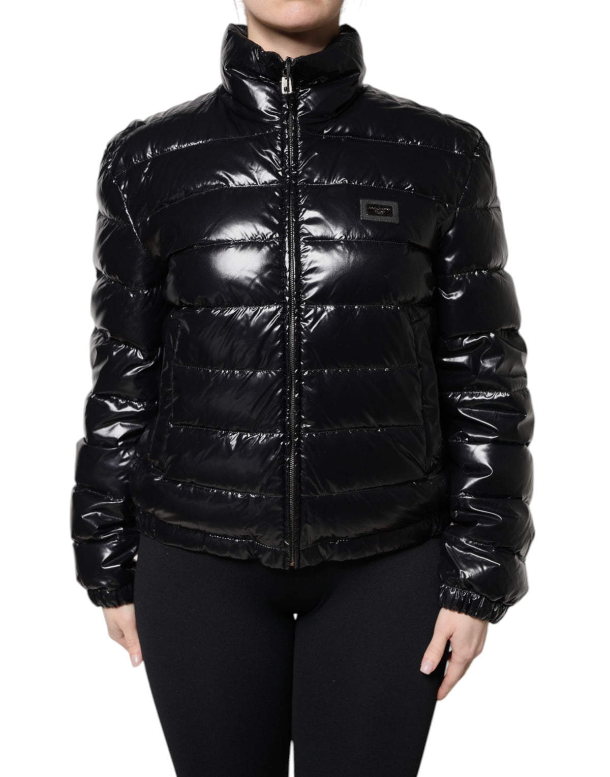 Indulge in the exquisite Dolce & Gabbana Black Logo Plaque Full Zip Puffer Jacket, a timeless blend of luxury and warmth, crafted in Italy for the discerning individual.