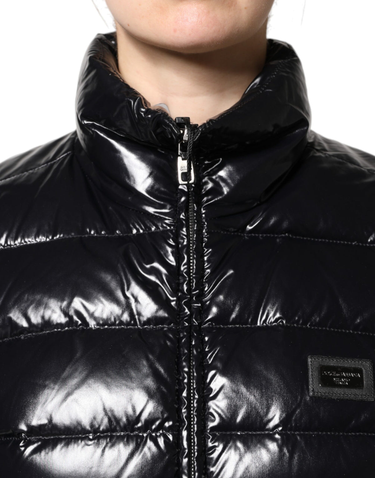 Indulge in the exquisite Dolce & Gabbana Black Logo Plaque Full Zip Puffer Jacket, a symbol of luxury crafted in Italy, merging warmth with timeless elegance for the discerning.