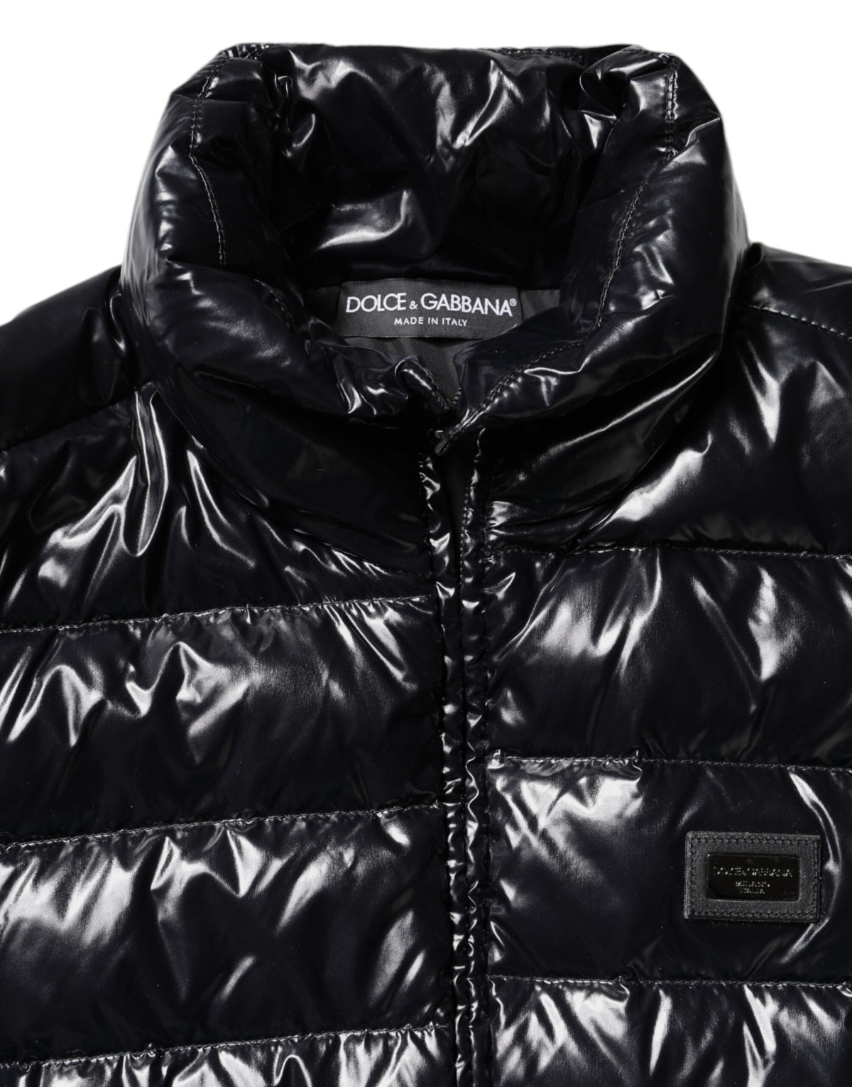Indulge in the exquisite Dolce & Gabbana Black Logo Plaque Full Zip Puffer Jacket, a symbol of luxury and sophistication, crafted in Italy for timeless elegance and warmth.