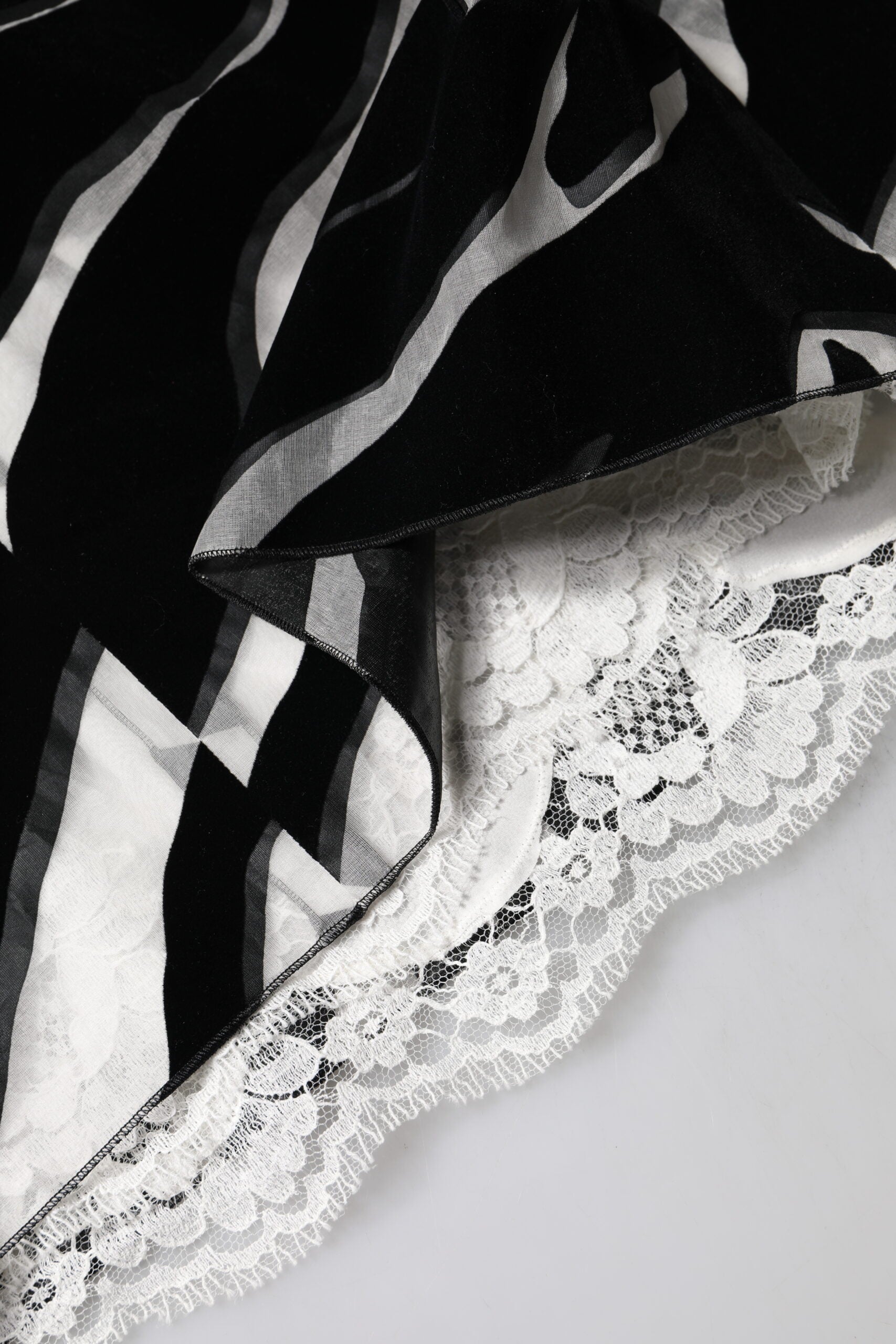 Indulge in the exquisite Dolce & Gabbana Black White Zebra A-line Sheath Mini Dress, a masterpiece of silk and nylon that embodies haute couture elegance and timeless allure.