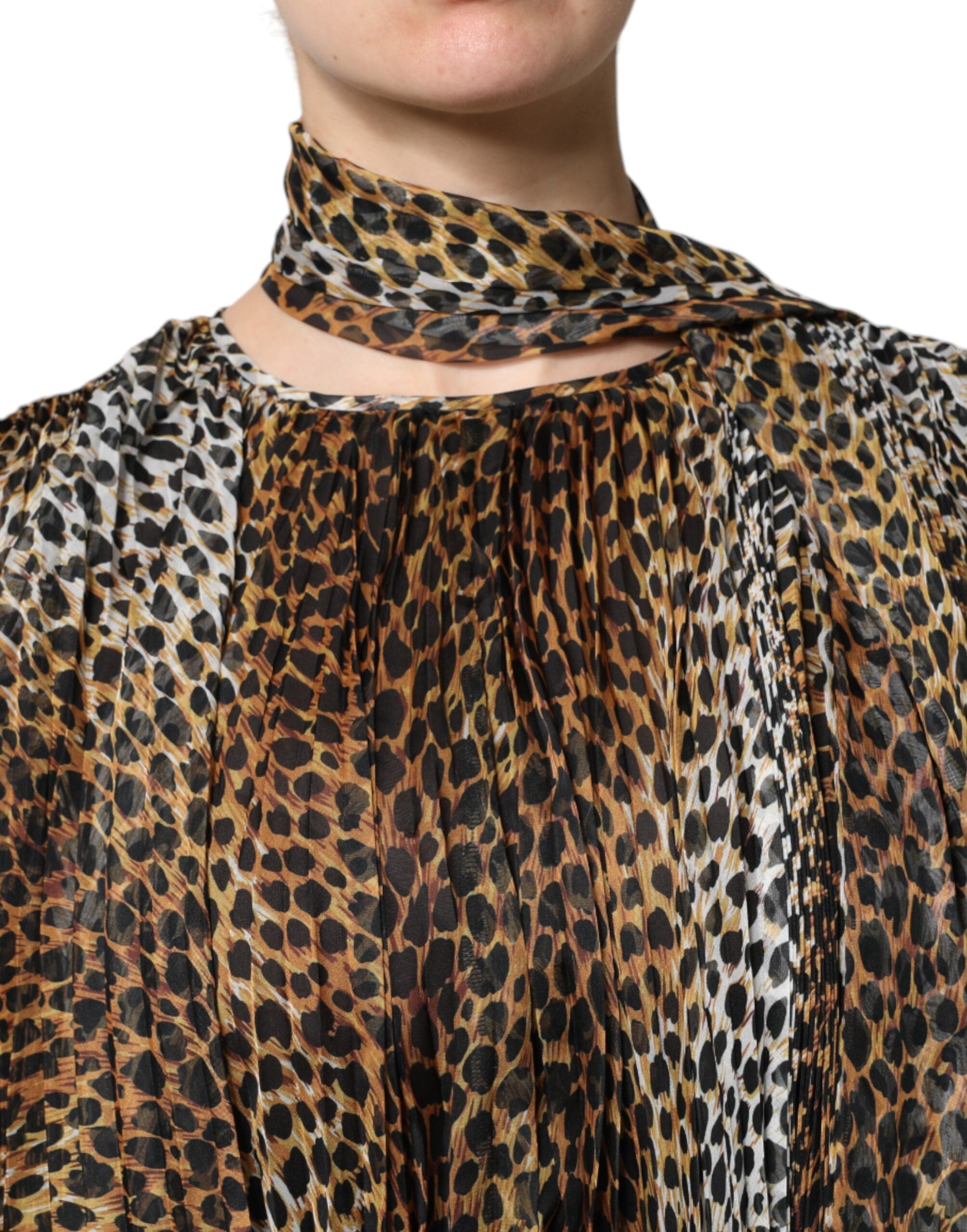 Indulge in the Dolce & Gabbana Brown Leopard Print Scarf Collared Chiffon Dress, a masterpiece of Italian craftsmanship, blending luxurious silk and polyester for timeless elegance.