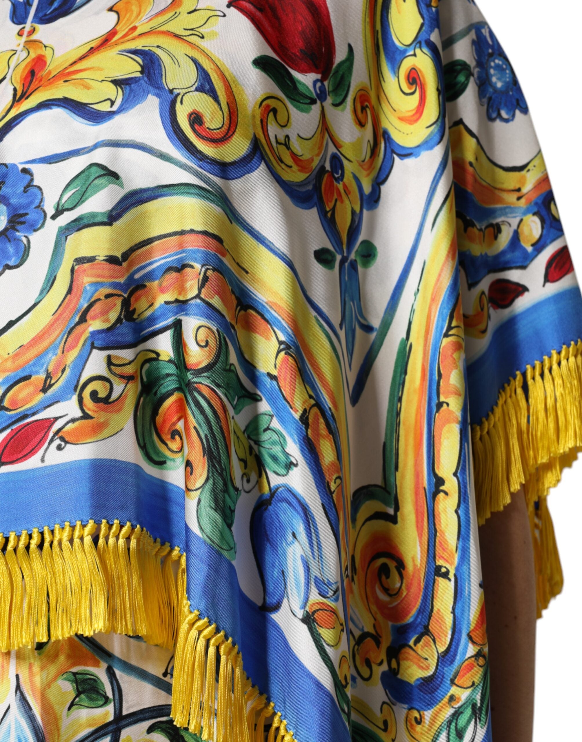 Experience the exquisite allure of the Dolce & Gabbana Multicolor Majolica Kaftan, a luxurious silk masterpiece that embodies timeless elegance and sophisticated charm.