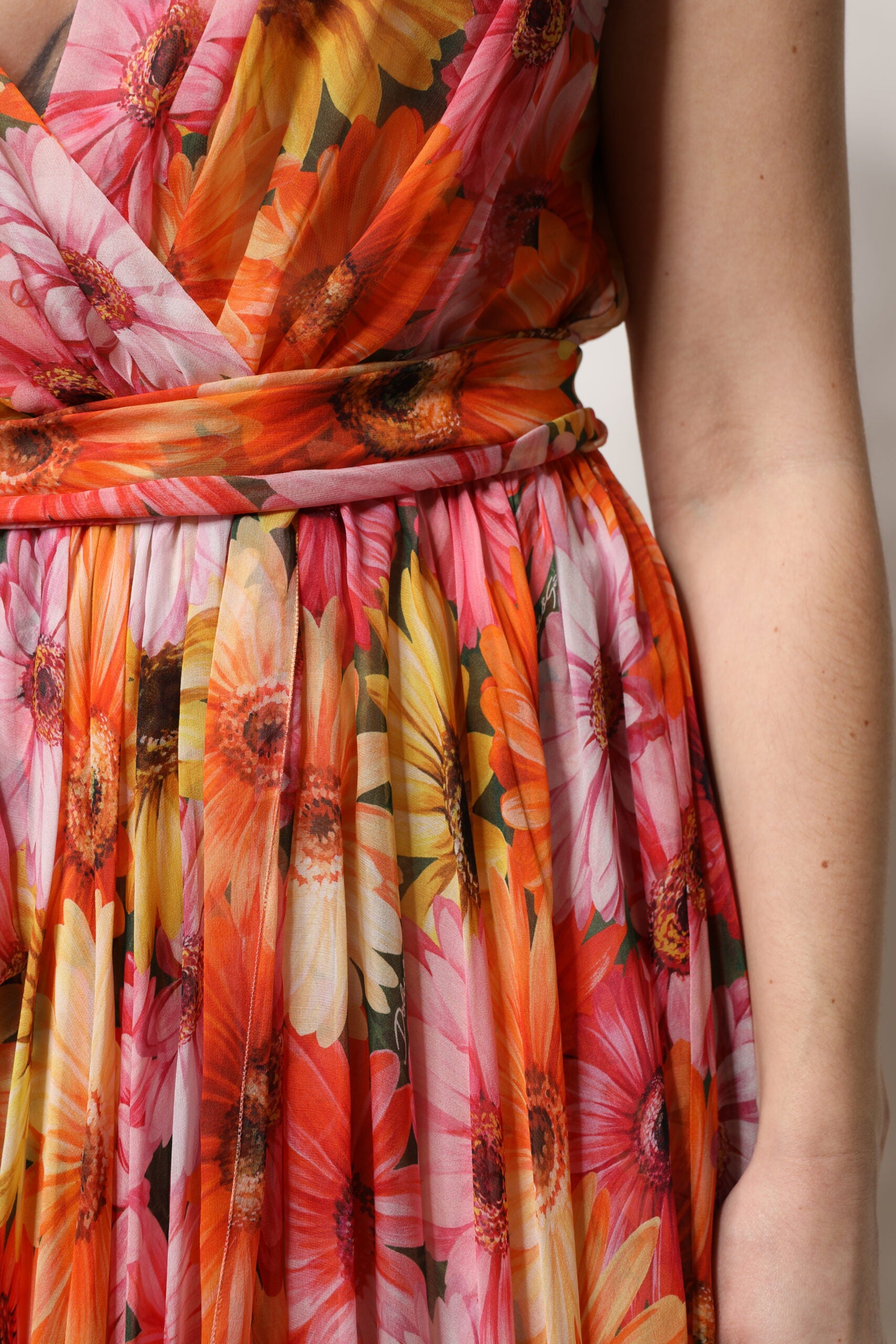 Discover the Dolce & Gabbana Multicolor Floral Silk V-neck Chiffon Dress, a masterpiece of Italian craftsmanship that embodies luxury and elegance for unforgettable moments.