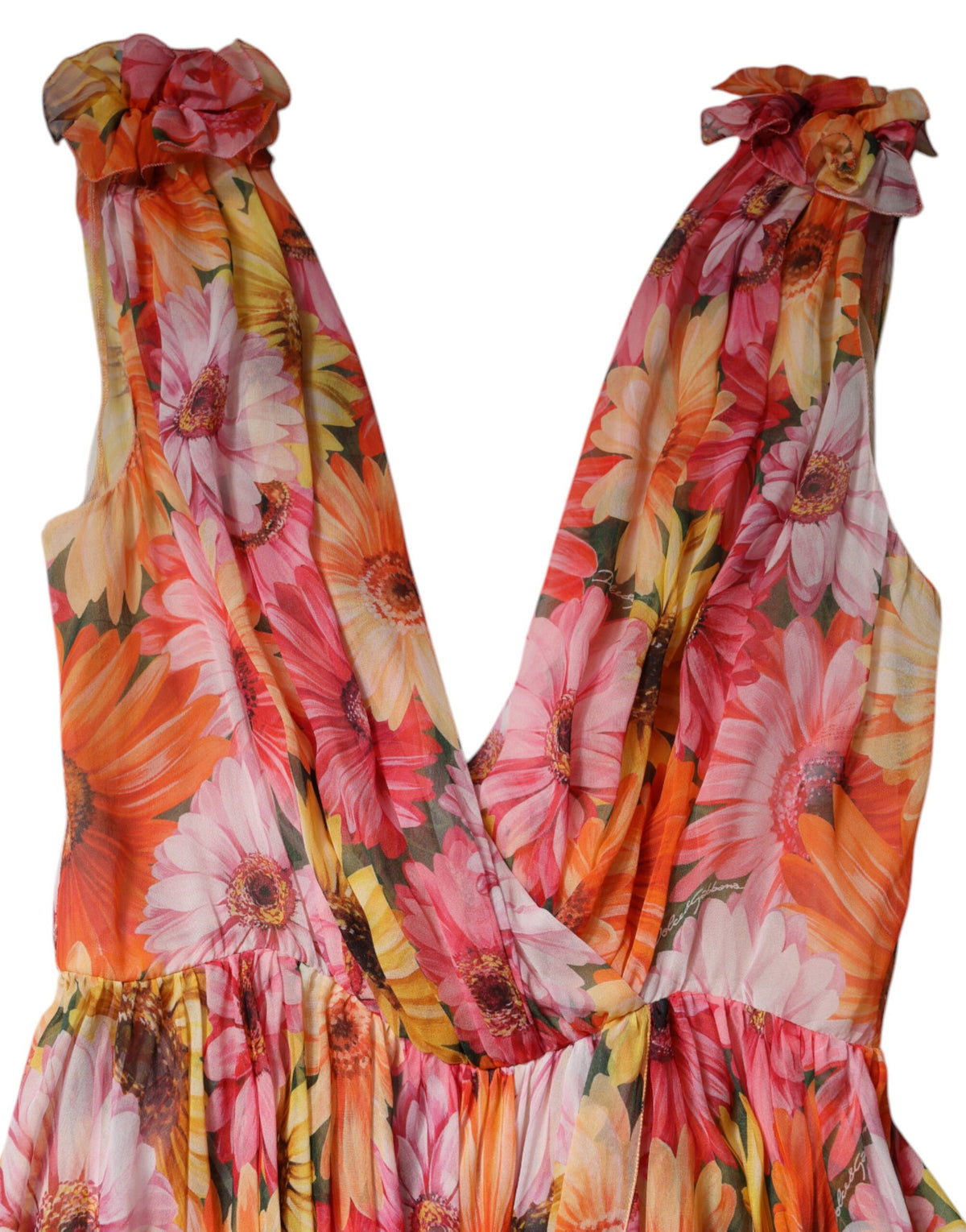 Experience the exquisite artistry of Dolce & Gabbana's Multicolor Floral Silk V-neck Chiffon Dress, a luxurious statement piece that embodies elegance and sophistication.