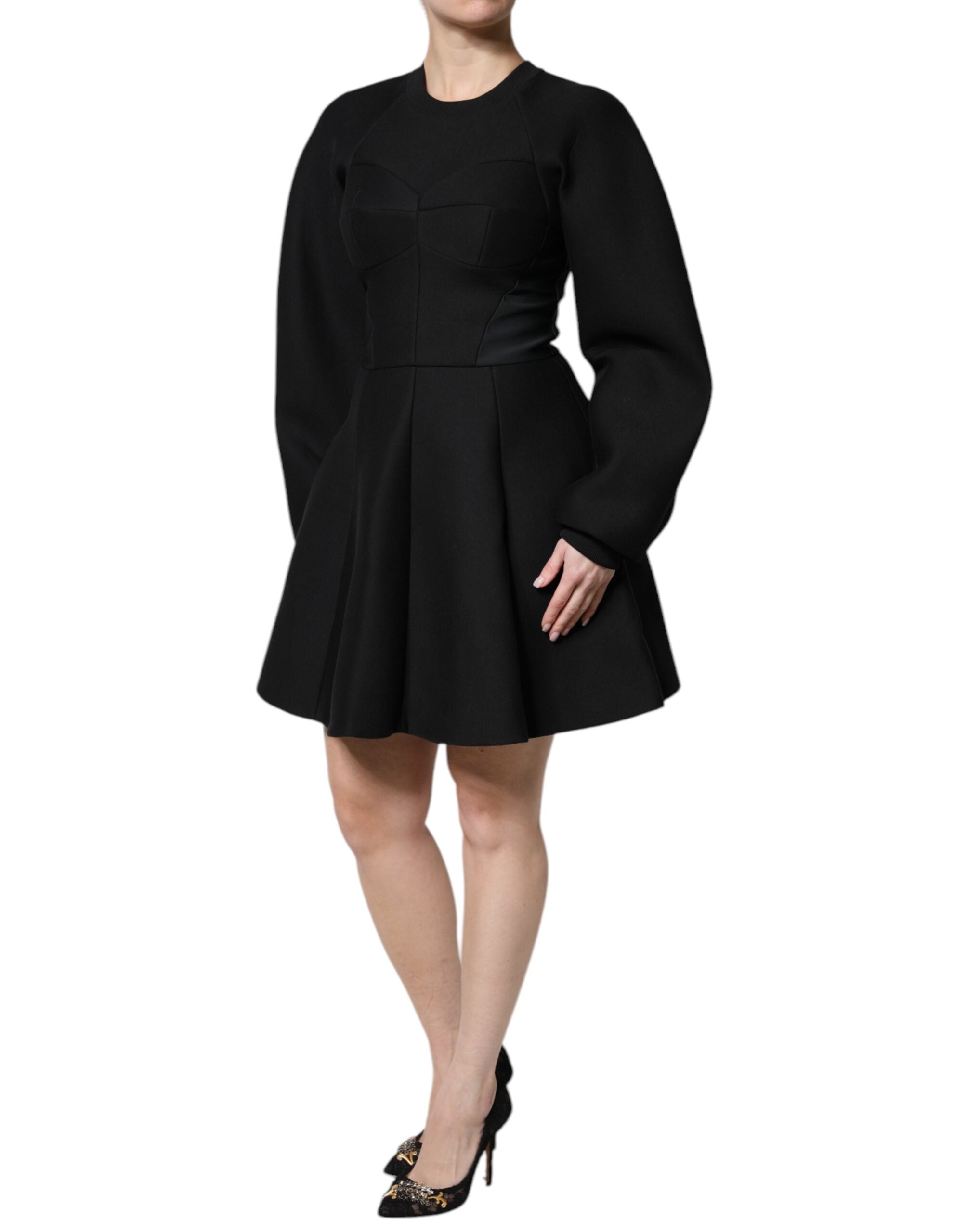 Indulge in the exquisite Dolce & Gabbana Black Cotton Long Sleeves A-line Mini Dress, where Italian craftsmanship meets luxurious elegance for the discerning individual.