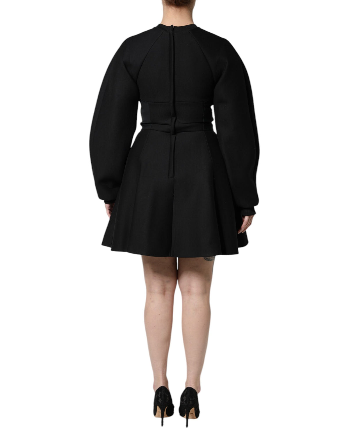 Indulge in the exquisite elegance of the Dolce & Gabbana Black Cotton Long Sleeves A-line Mini Dress, a masterpiece of Italian craftsmanship designed for the discerning individual.
