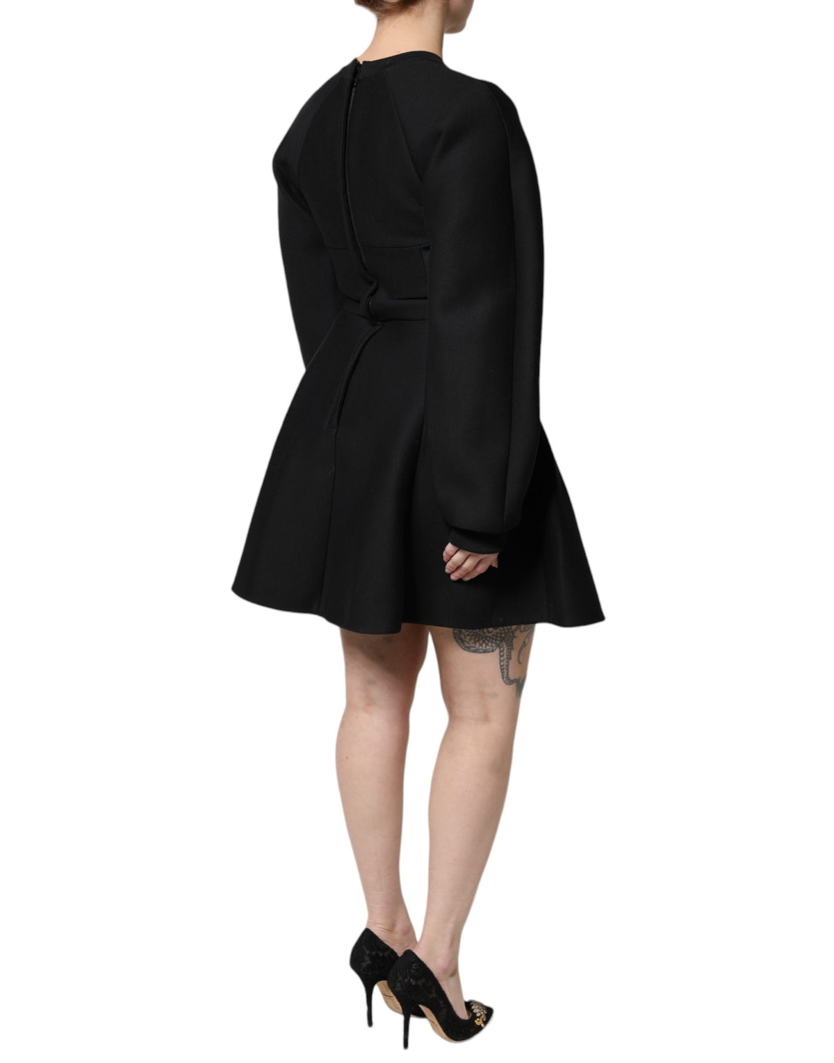 Discover the exquisite Dolce & Gabbana Black Cotton Long Sleeves A-line Mini Dress, a masterpiece of Italian craftsmanship that embodies elegance and sophistication for any occasion.