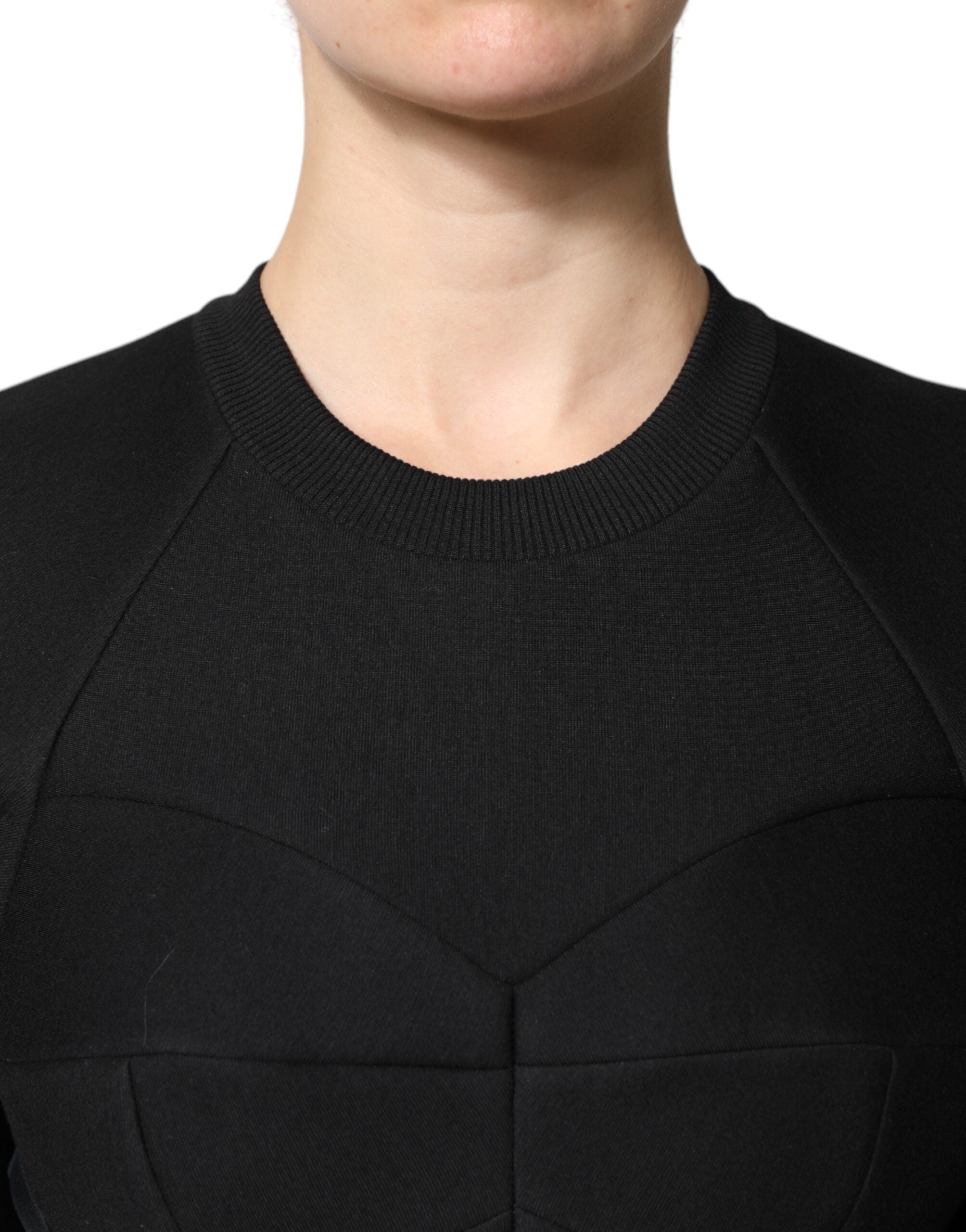Indulge in the exquisite Dolce & Gabbana Black Cotton Long Sleeves A-line Mini Dress, a masterpiece of Italian craftsmanship that embodies elegance and sophistication for any occasion.