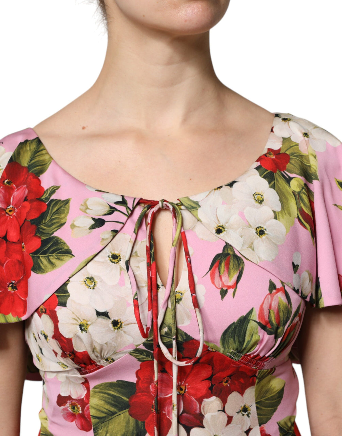 Elevate your wardrobe with the Dolce & Gabbana Pink Floral Silk Blouse, a masterpiece of Italian craftsmanship that embodies timeless elegance and sensuality.