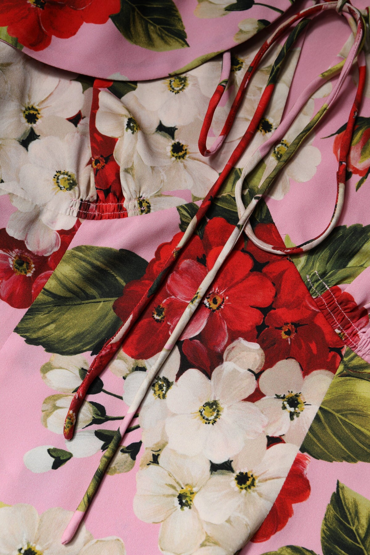 Indulge in the exquisite Dolce & Gabbana Pink Floral Silk Blouse, a luxurious blend of silk and elastane, embodying timeless elegance and Italian craftsmanship for the discerning individual.