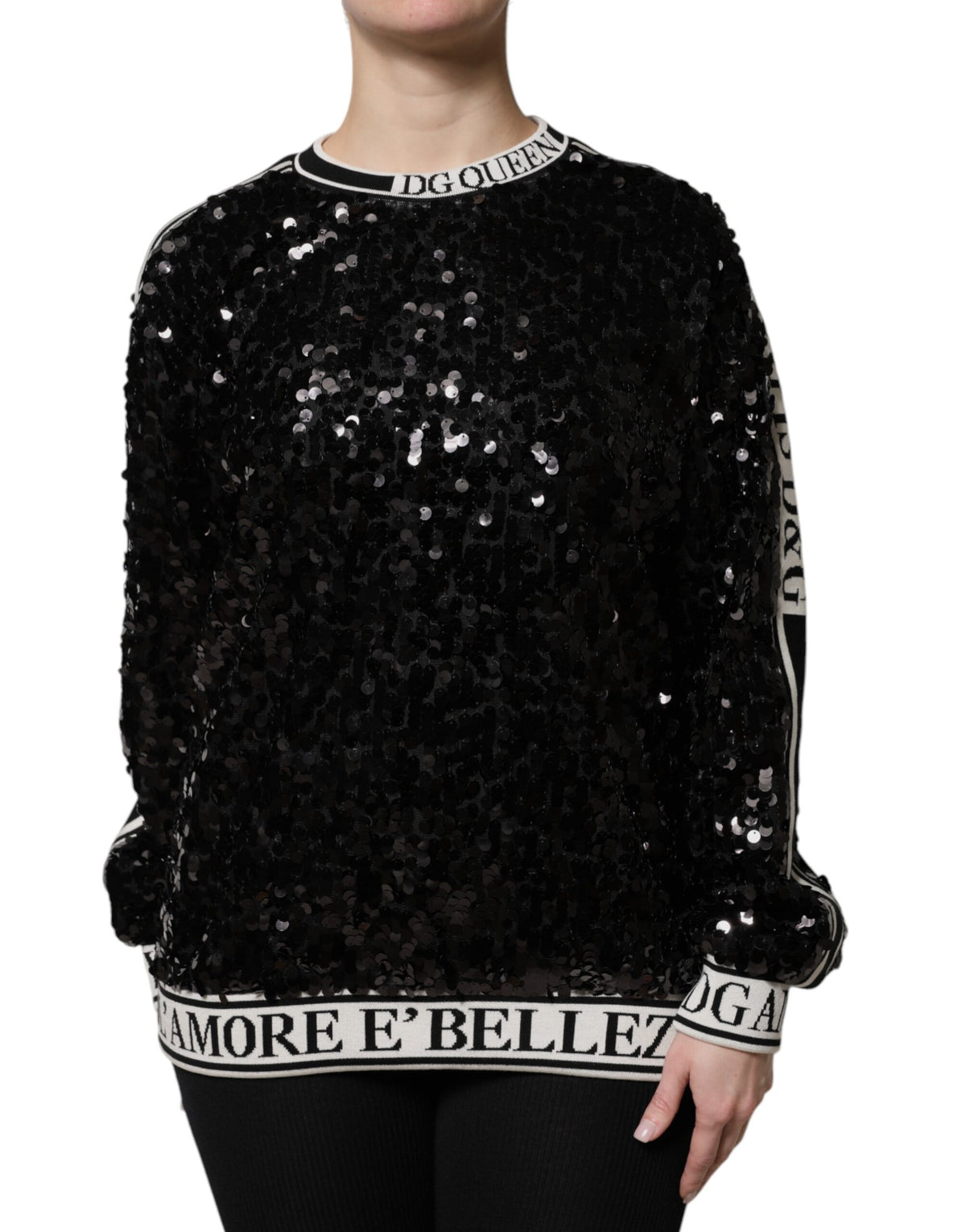 Elevate your wardrobe with the Dolce & Gabbana Black DG Queen Sequin Pullover Sweater, a masterpiece of silk and polyester that embodies luxury and sophistication.
