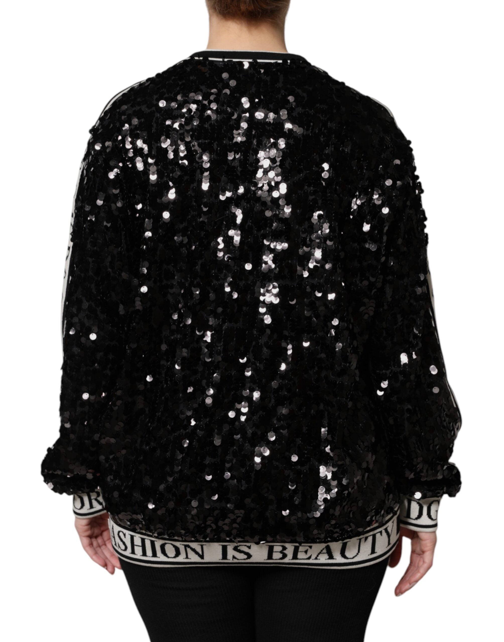 Elevate your wardrobe with the Dolce & Gabbana Black DG Queen Sequin Pullover Sweater, a masterpiece of silk and polyester that embodies haute couture elegance and timeless allure.