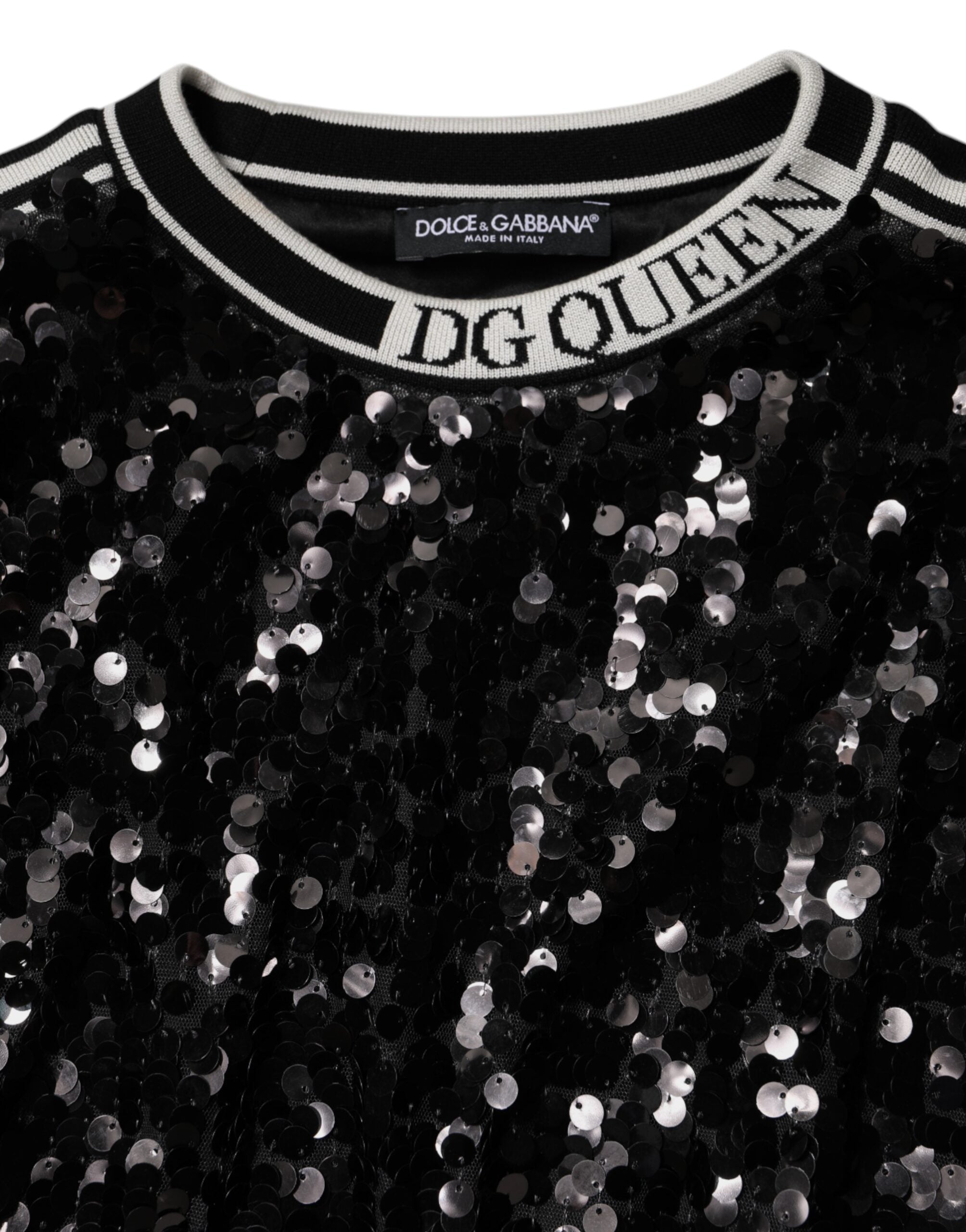 Elevate your wardrobe with the Dolce & Gabbana Black DG Queen Sequin Pullover Sweater, a masterpiece of silk and polyester that embodies haute couture elegance and timeless allure.