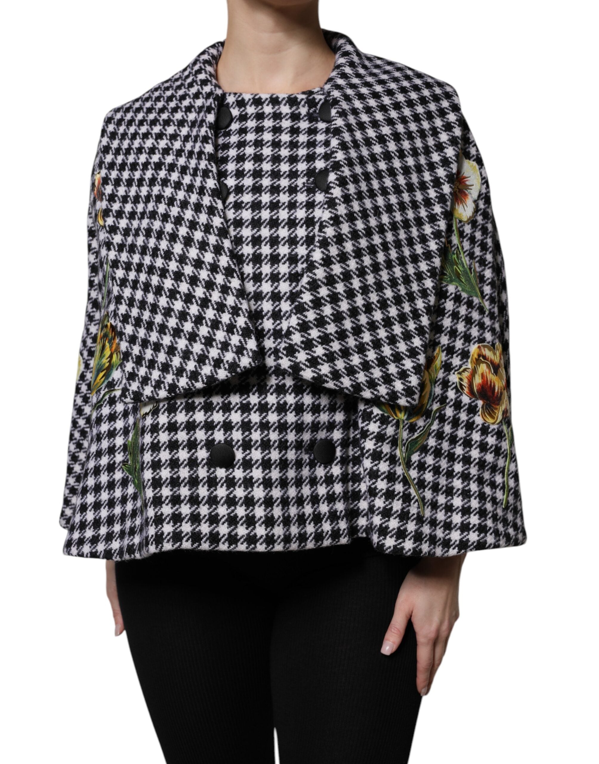 Elevate your wardrobe with the Dolce & Gabbana Black White Monochrome Floral Cape Jacket, a masterpiece of virgin wool and silk, embodying exquisite Italian craftsmanship and timeless elegance.