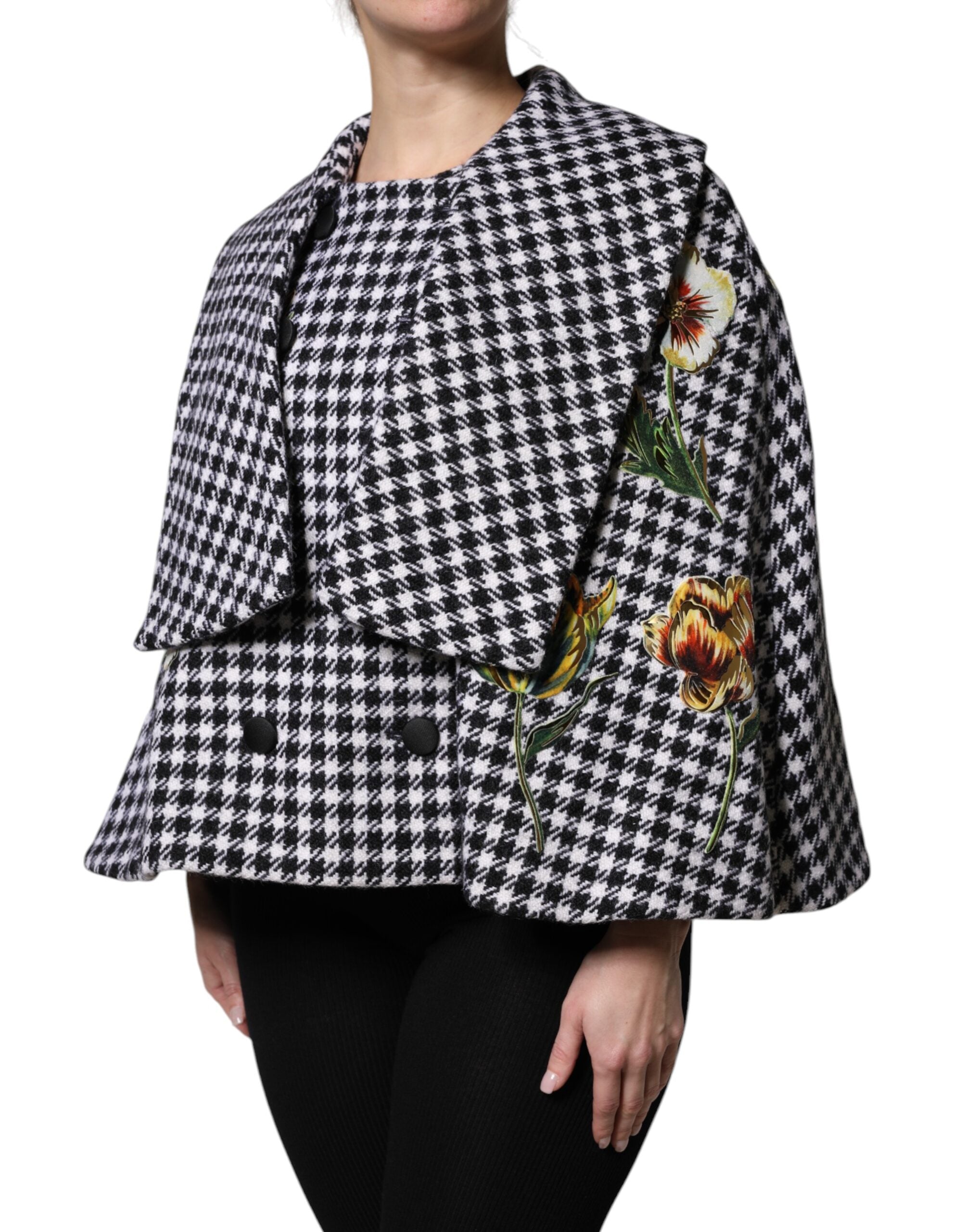 Indulge in the exquisite Dolce & Gabbana Black White Monochrome Floral Cape Jacket, a masterpiece of virgin wool and silk, embodying timeless elegance and sophisticated allure.