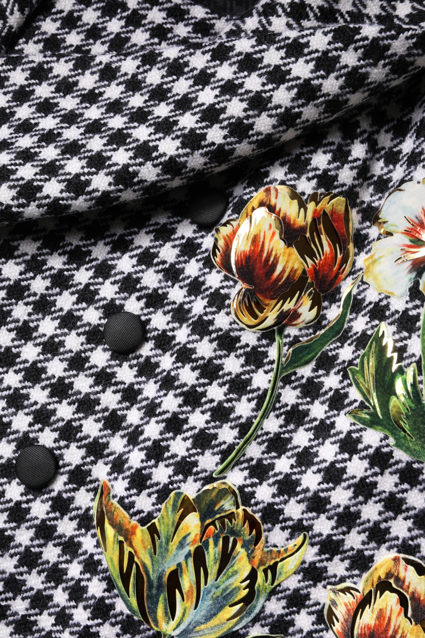 Elevate your wardrobe with the Dolce & Gabbana Black White Monochrome Floral Cape Jacket, a luxurious blend of virgin wool and silk, embodying exquisite Italian craftsmanship and timeless elegance.