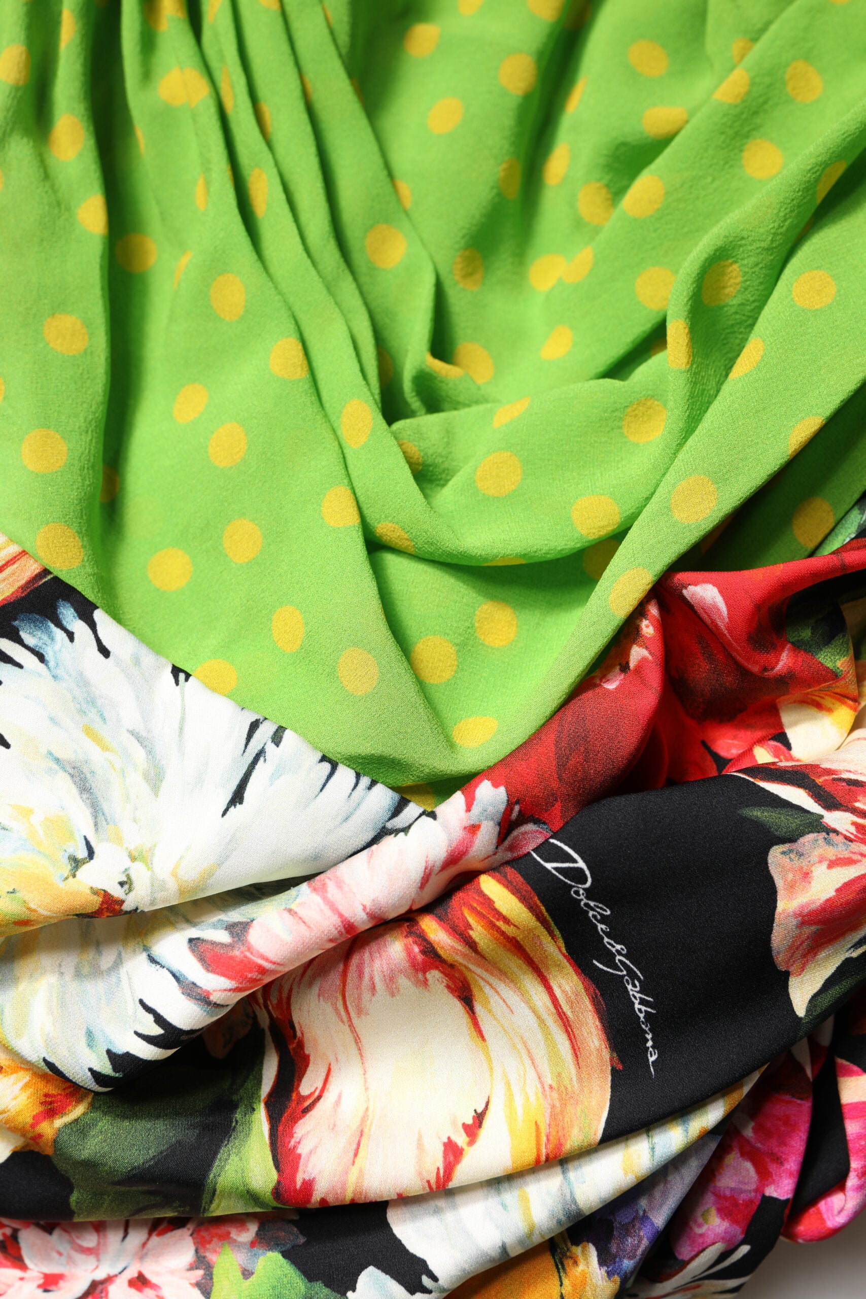 Discover the Dolce & Gabbana Multicolor Floral Patchwork Fitted Mini Dress, a luxurious blend of silk and elastane, crafted in Italy for the discerning individual who embodies elegance and allure.