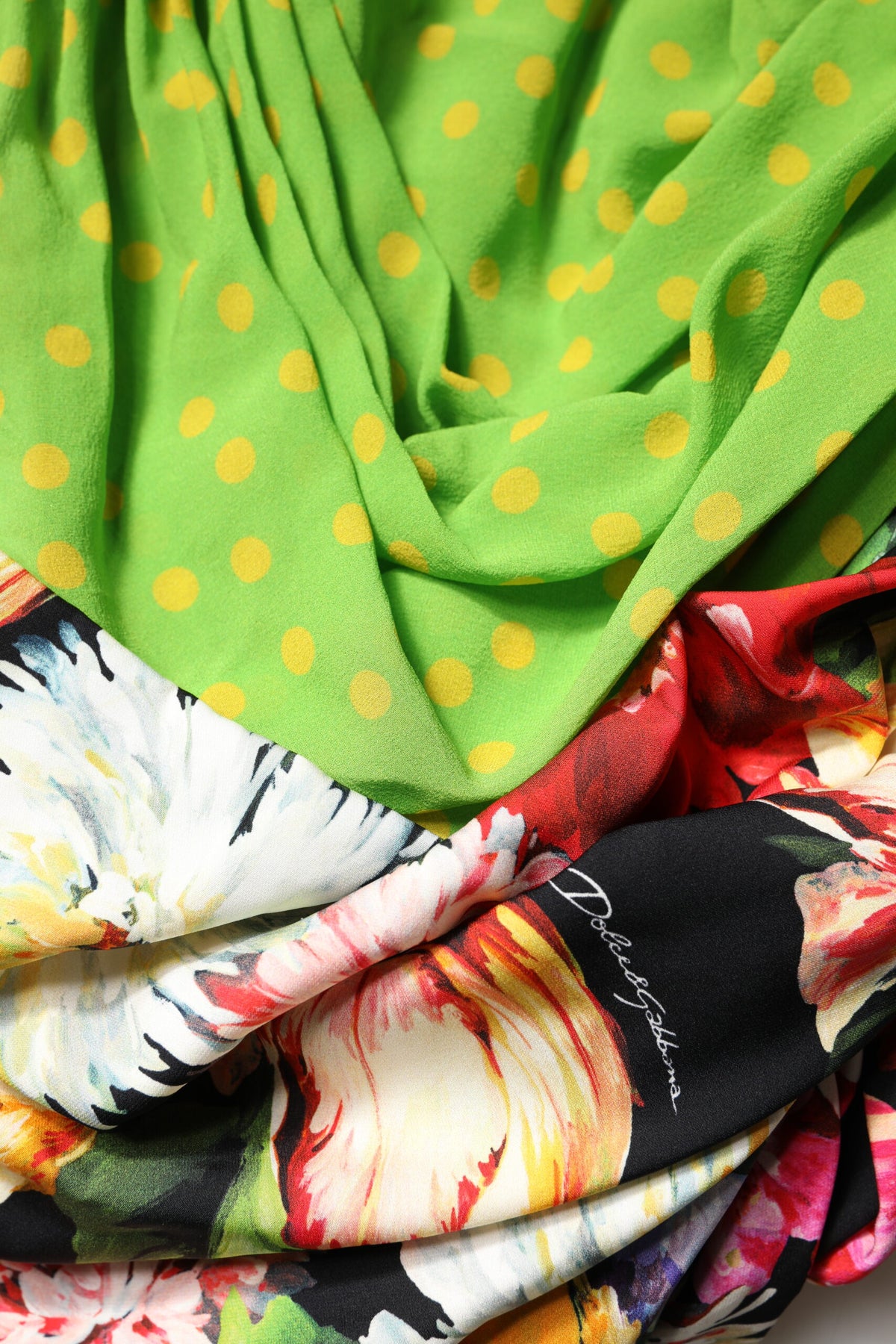 Elevate your wardrobe with the Dolce & Gabbana Multicolor Floral Patchwork Fitted Mini Dress, a masterpiece of silk and elastane that embodies luxury and sophistication.