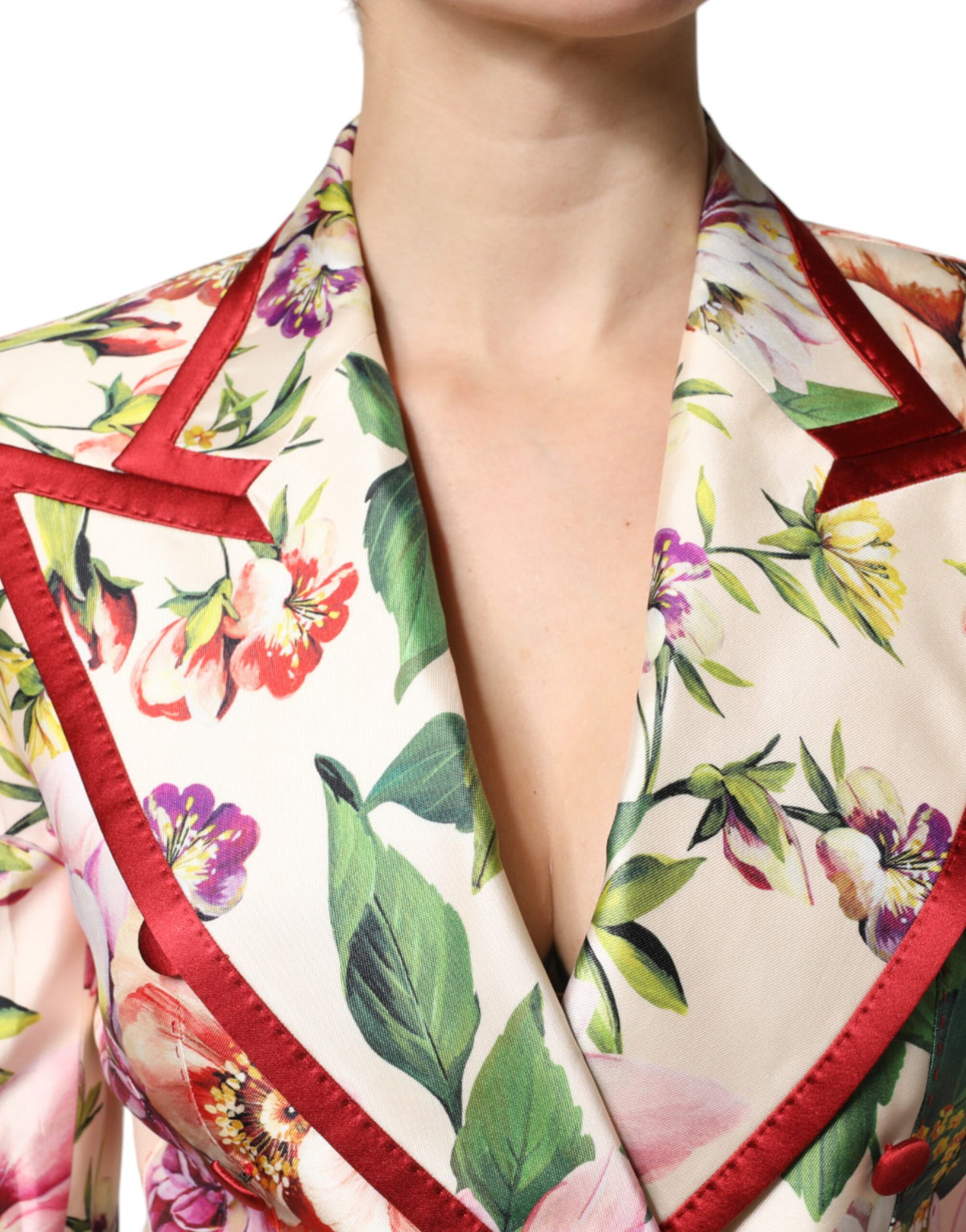 Elevate your wardrobe with the Dolce & Gabbana Multicolor Floral Double Breasted Jacket, a luxurious silk masterpiece that embodies exquisite Italian craftsmanship and timeless elegance.