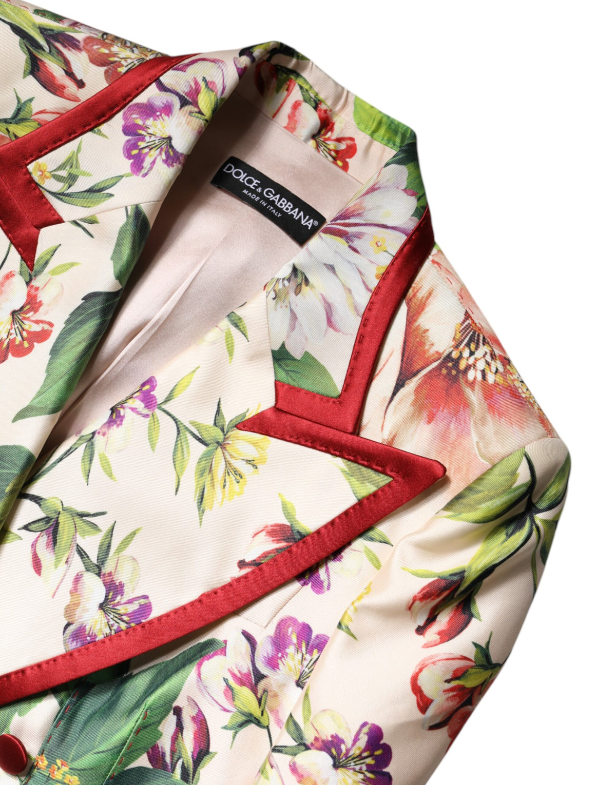 Indulge in the exquisite Dolce & Gabbana Multicolor Floral Double Breasted Jacket, a luxurious silk masterpiece that embodies sophistication and timeless elegance.