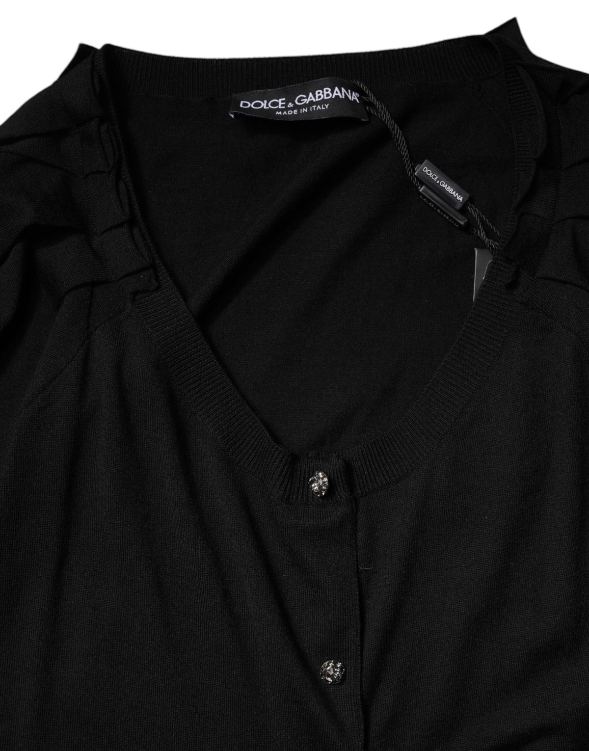 Elevate your wardrobe with the Dolce & Gabbana Black Button Down Short Sleeve Blouse, crafted from luxurious virgin wool, embodying timeless elegance and sophisticated allure.