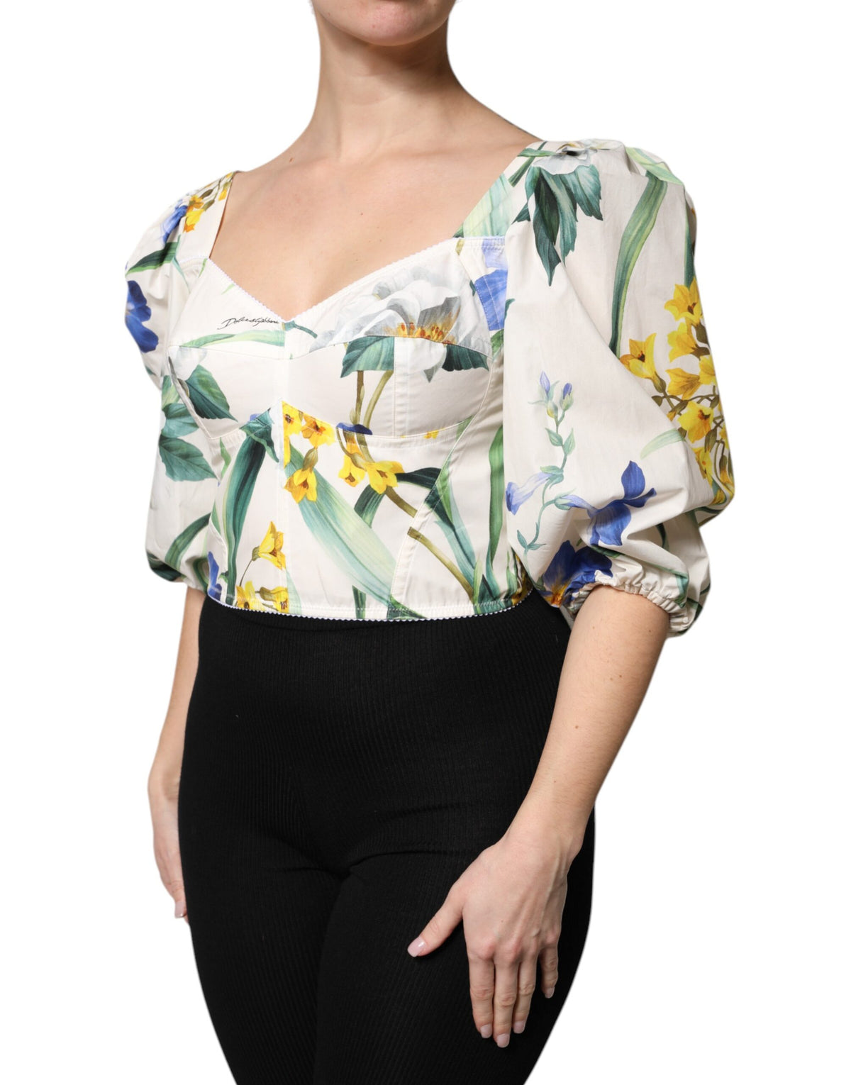 Elevate your wardrobe with the Dolce & Gabbana White Floral Puff Sleeves Crop Blouse, a luxurious blend of 100% cotton and exquisite craftsmanship, perfect for any elegant occasion.