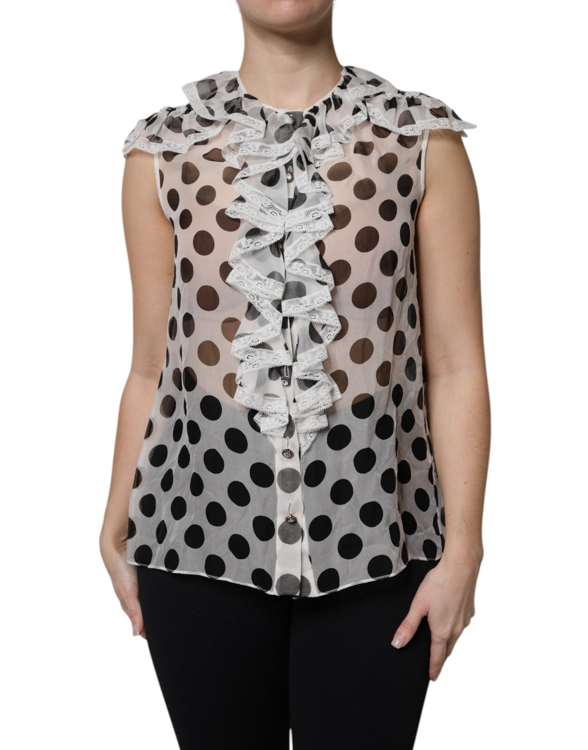 Indulge in the exquisite Dolce & Gabbana White Black Polka Dot Cotton Sleeveless Top, a timeless blend of silk and cotton that embodies luxury and elegance for any occasion.