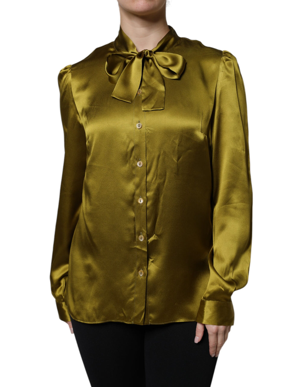 Indulge in the exquisite allure of Dolce & Gabbana's olive green silk blouse, where luxurious craftsmanship meets timeless elegance, perfect for the discerning individual.