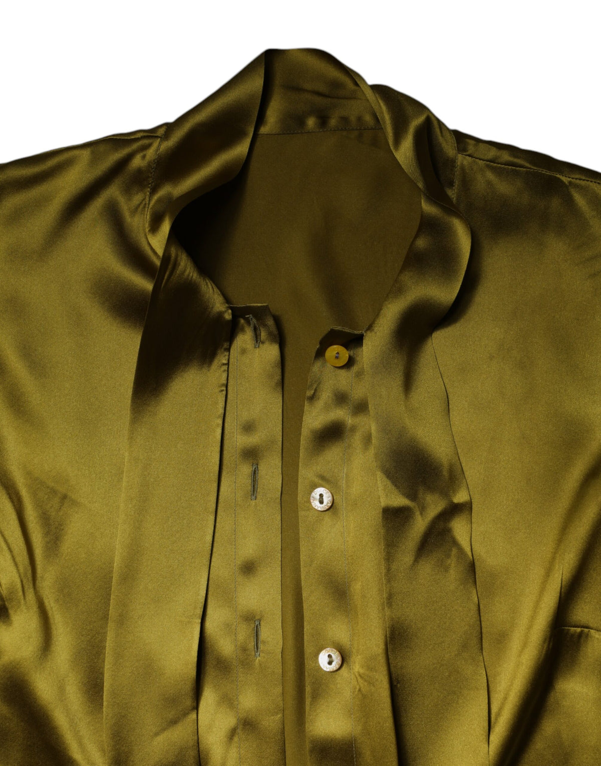 Discover the exquisite allure of the Dolce & Gabbana Olive Green Ascot Collar Blouse, crafted from luxurious silk, embodying sophistication and timeless elegance for the discerning individual.
