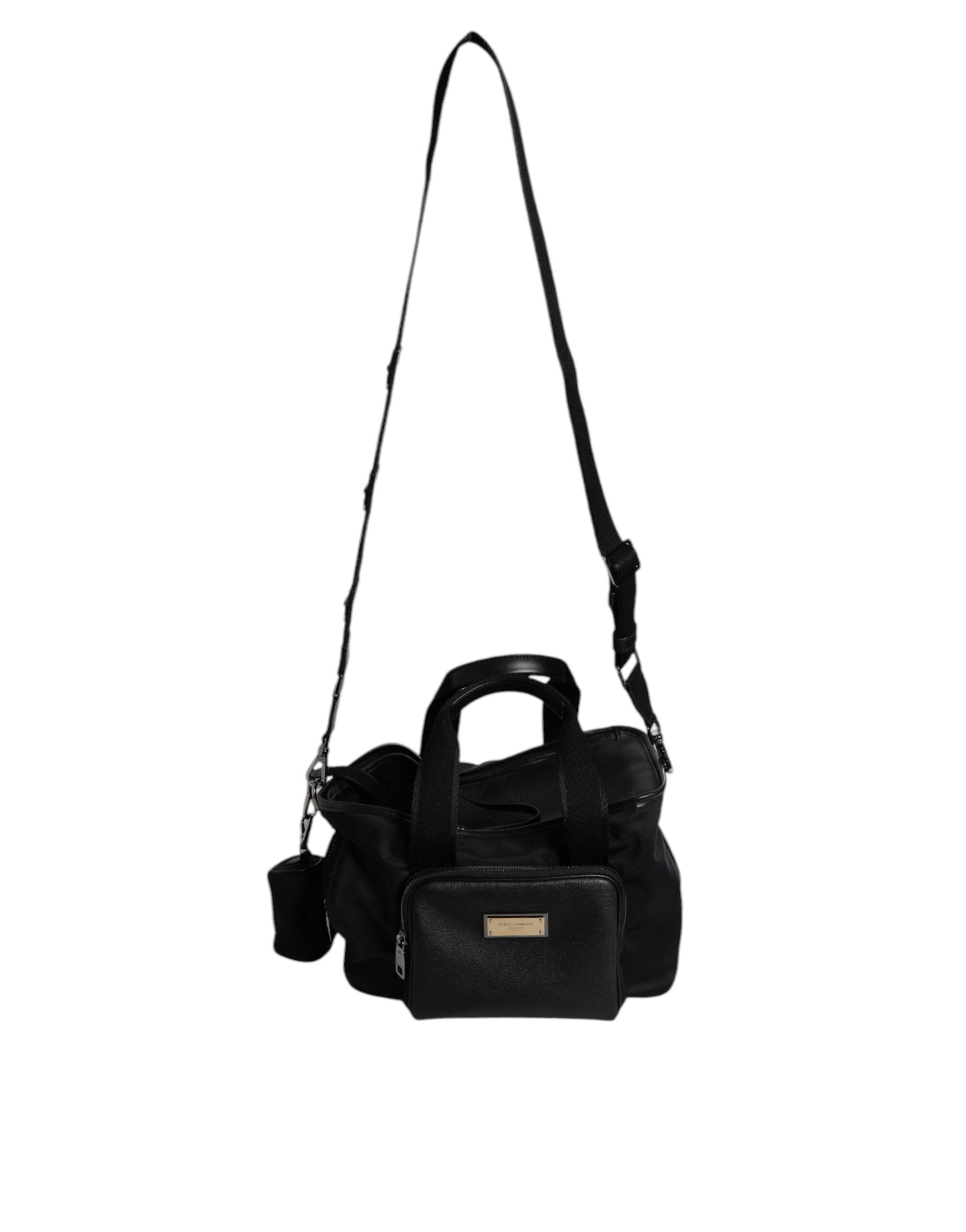 Indulge in the exquisite Dolce & Gabbana Black Shoulder Strap Pet Carry Bag, a luxurious blend of nylon, leather, and acrylic, designed for the discerning pet owner.
