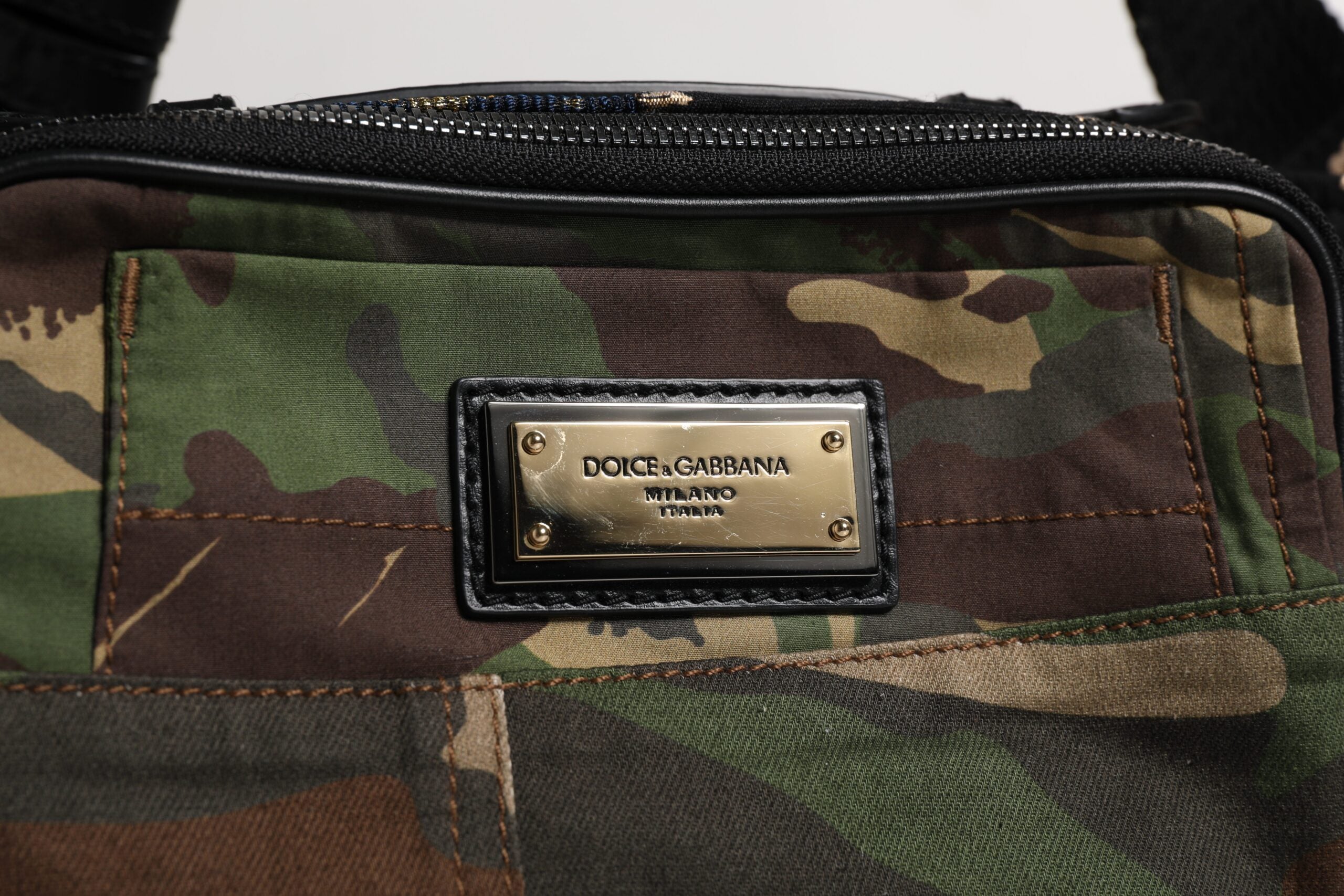 Elevate your style with the Dolce & Gabbana Multicolor Camouflage Patchwork Waist Fanny Pack, a luxurious blend of cotton and leather, embodying exquisite craftsmanship and timeless elegance.