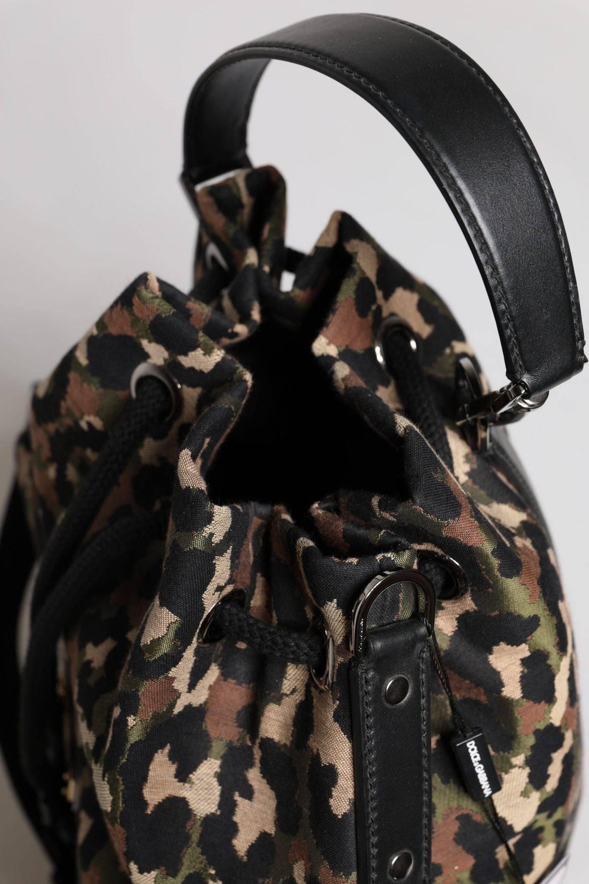Indulge in the exquisite Dolce & Gabbana Multicolor Leopard Cotton Shoulder Bucket Bag, a luxurious blend of craftsmanship and style that elevates your fashion statement.